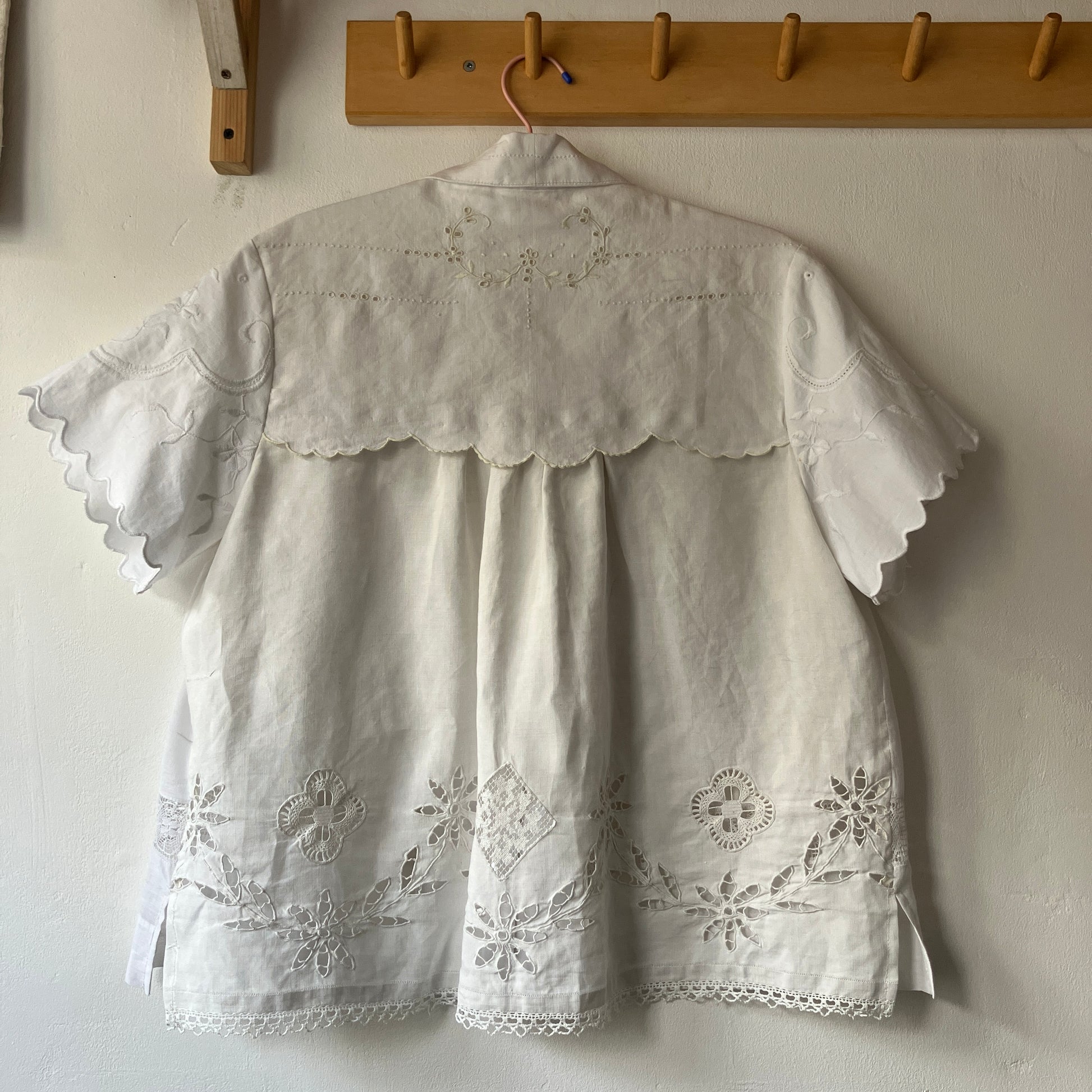 Short-sleeved white swingy shirt made from vintage cutwork linen and cotton cutwork table and tray cloths.