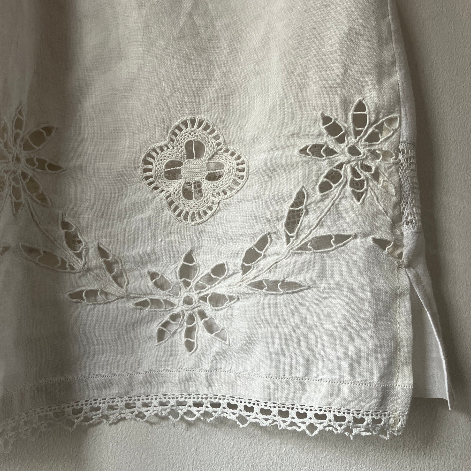 Short-sleeved white swingy shirt made from vintage cutwork linen and cotton cutwork table and tray cloths.