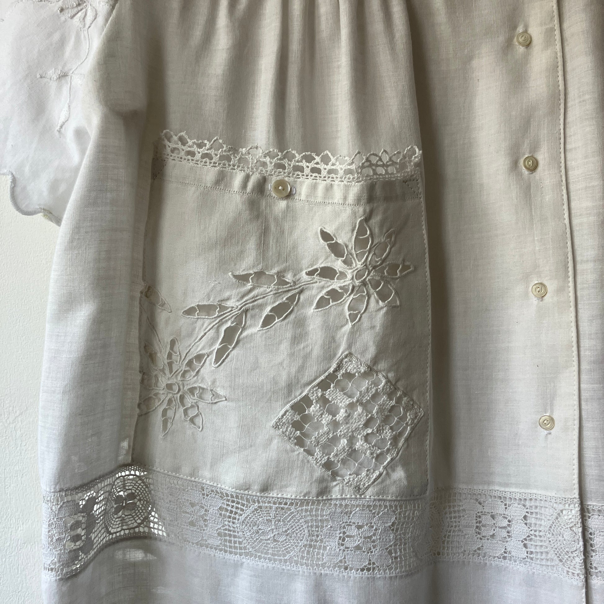 Short-sleeved white swingy shirt made from vintage cutwork linen and cotton cutwork table and tray cloths.