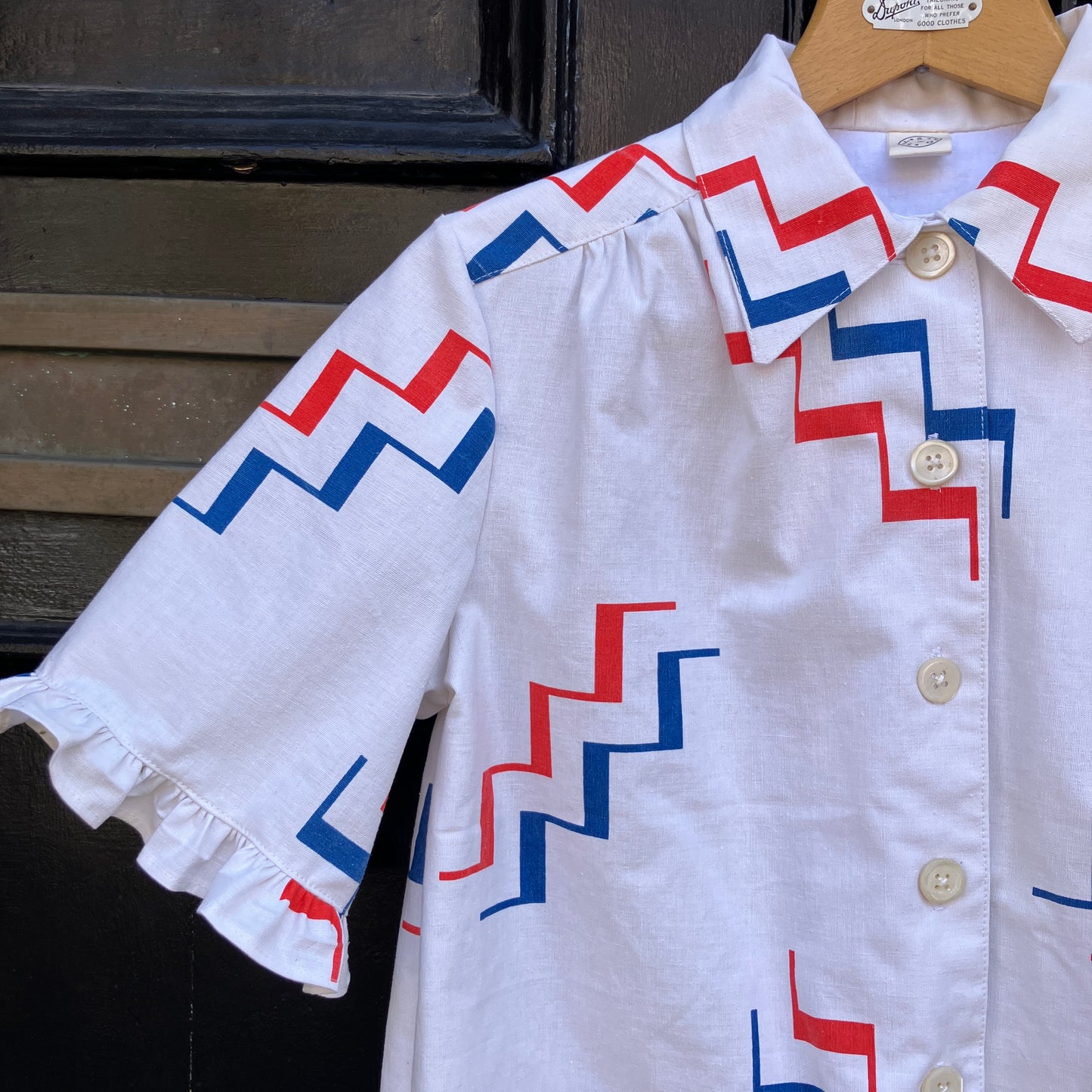 Geometric-print shirt with fancy ruffles around the sleeves