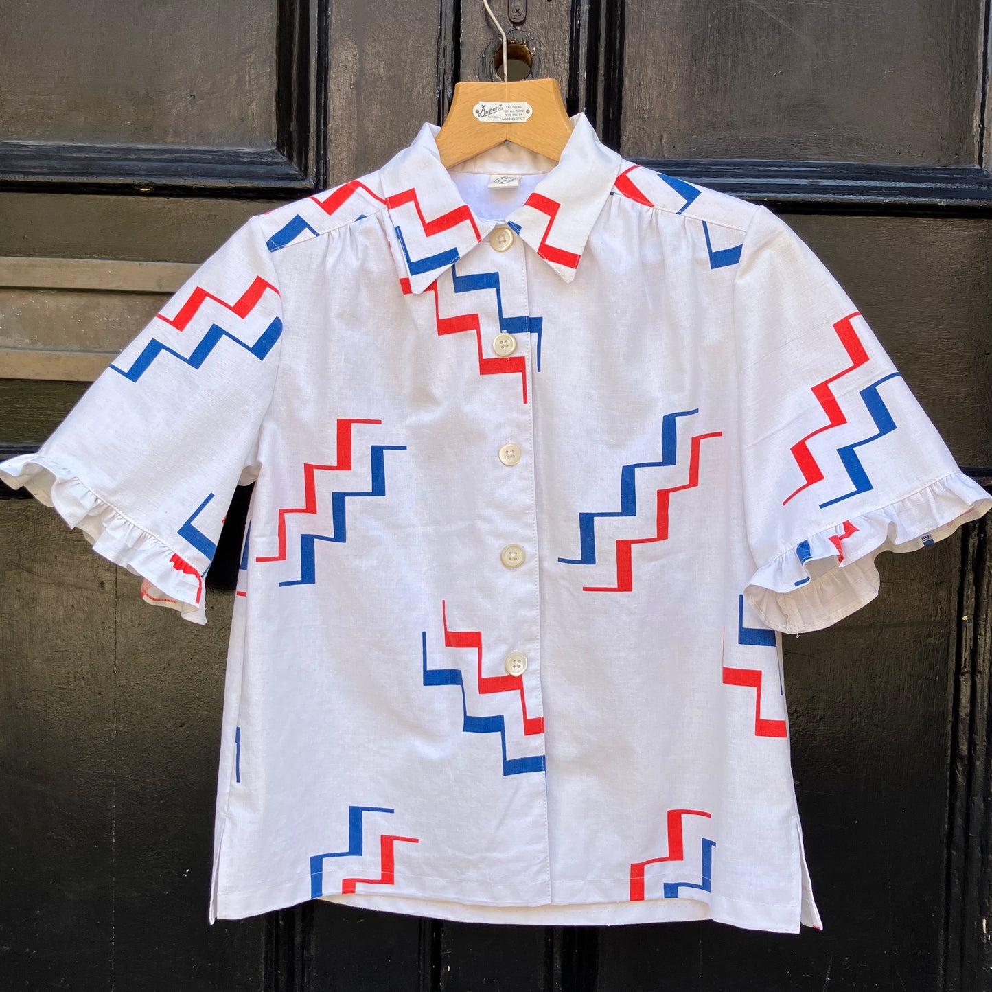 Geometric-print shirt with fancy ruffles around the sleeves