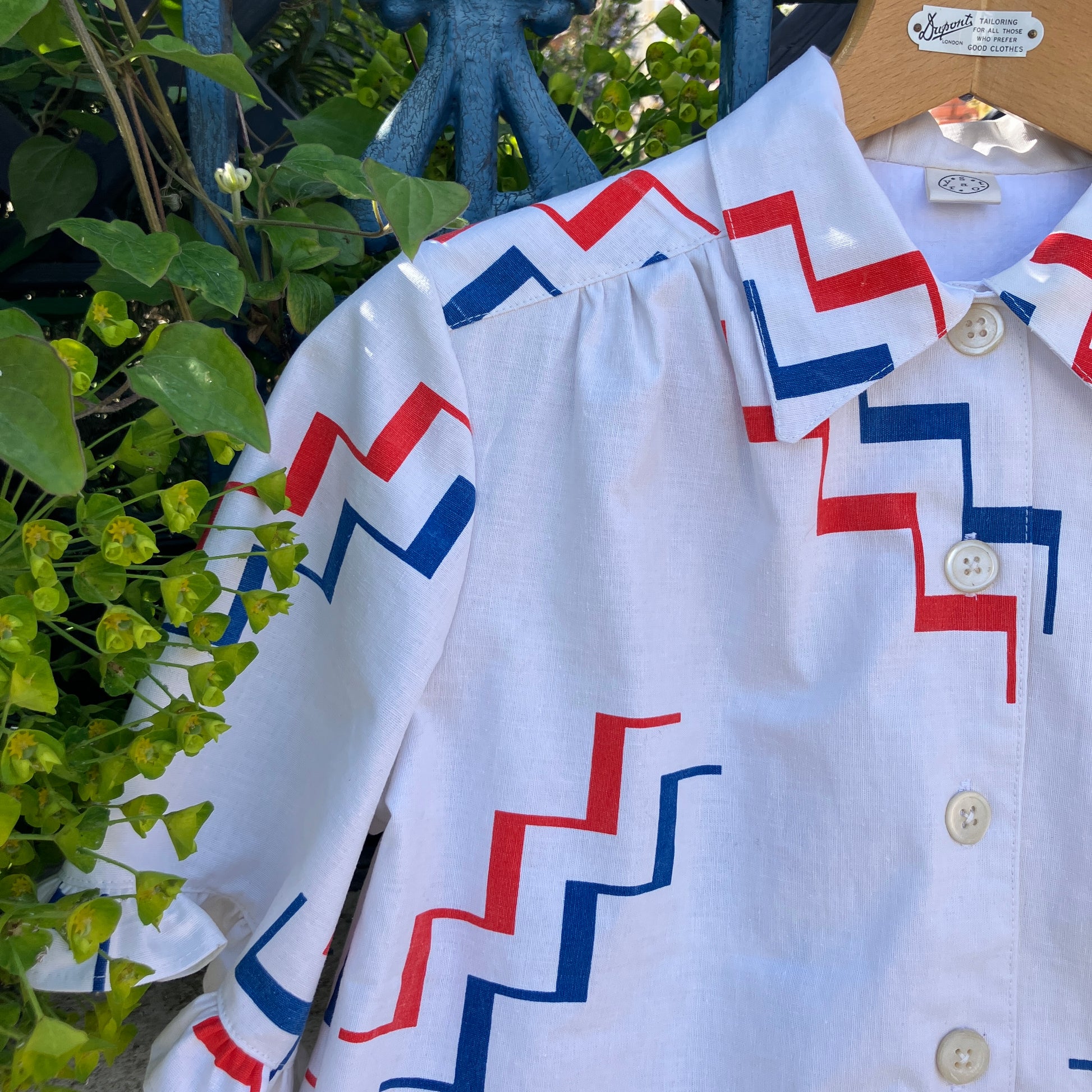 Geometric-print shirt with fancy ruffles around the sleeves