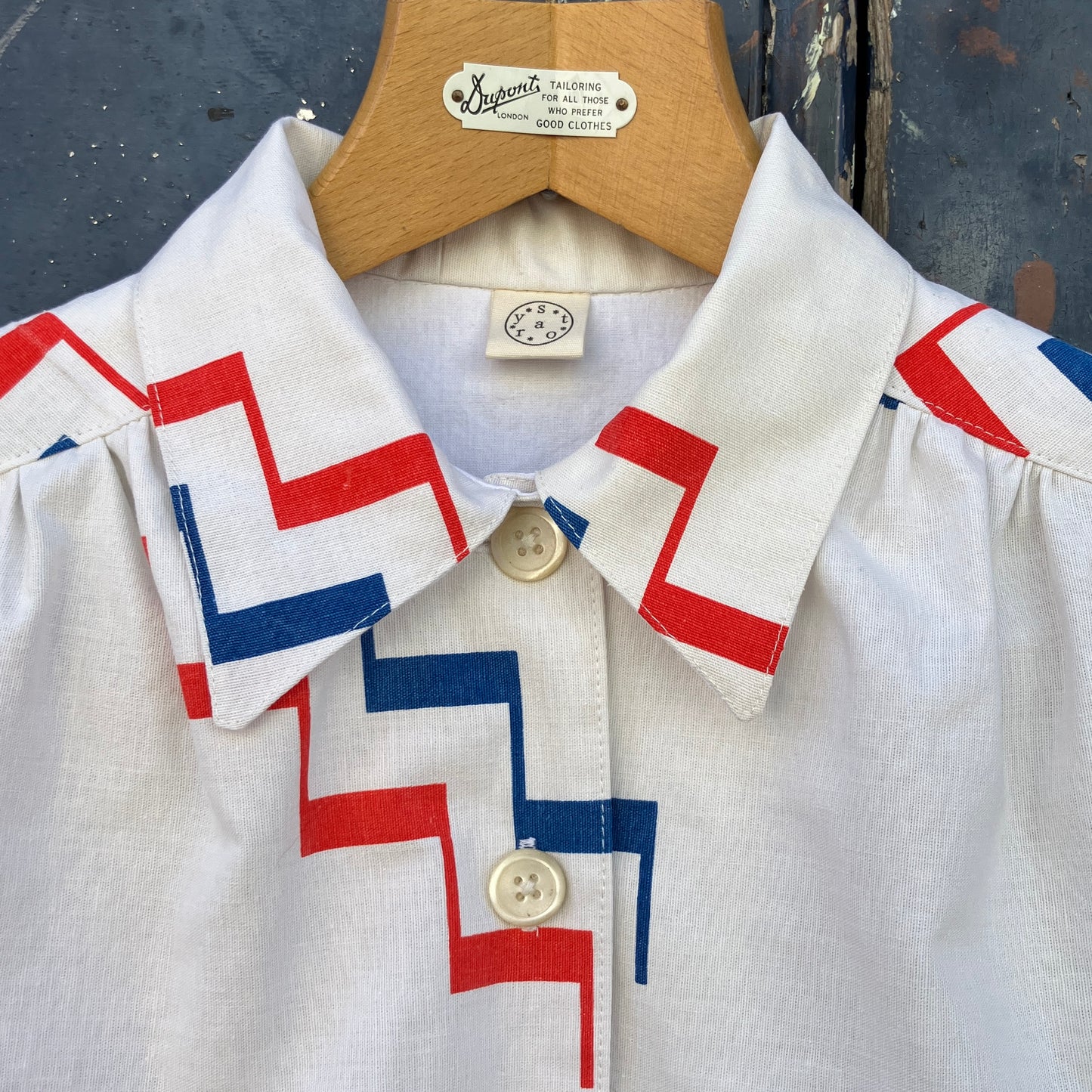 Geometric-print shirt with fancy ruffles around the sleeves