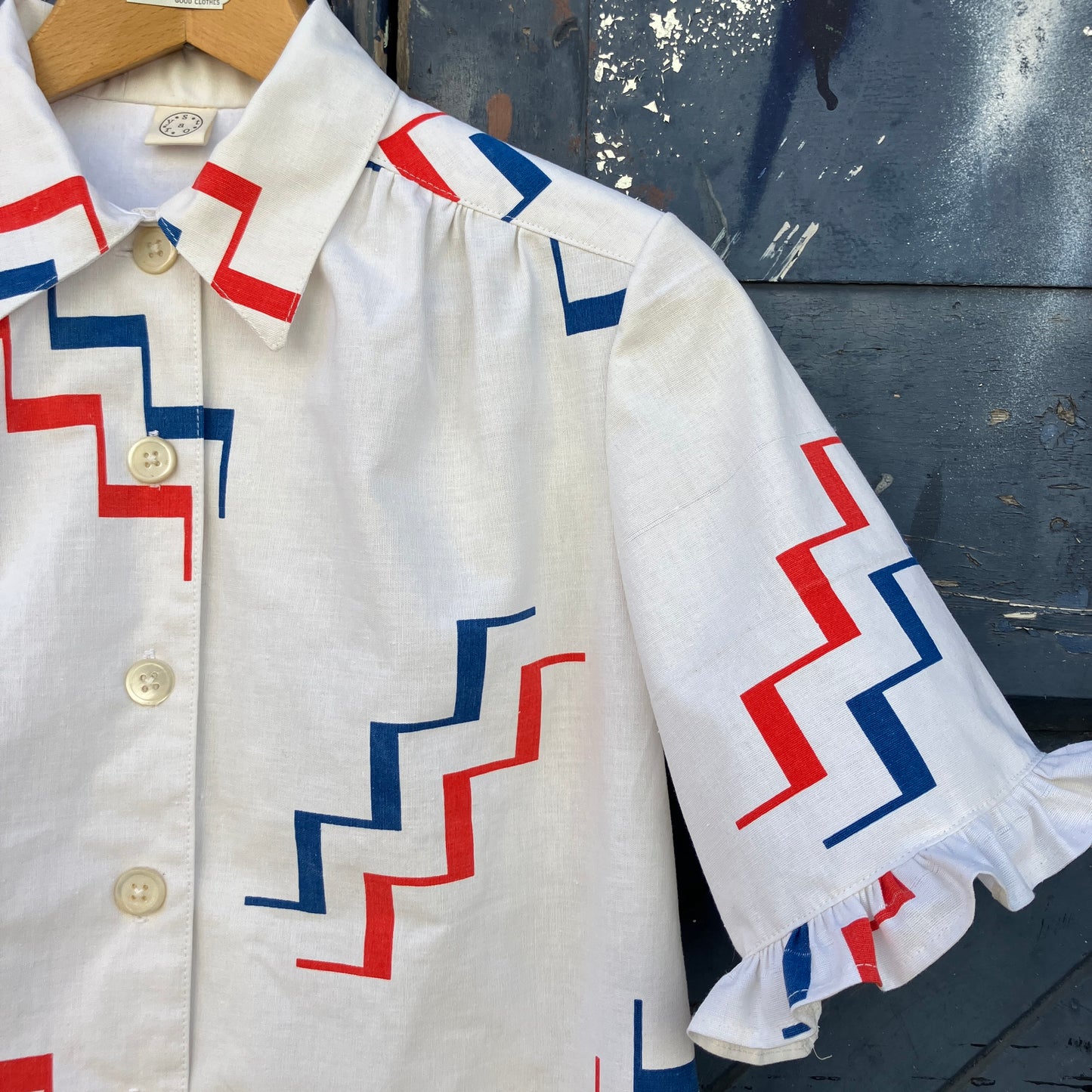 Geometric-print shirt with fancy ruffles around the sleeves