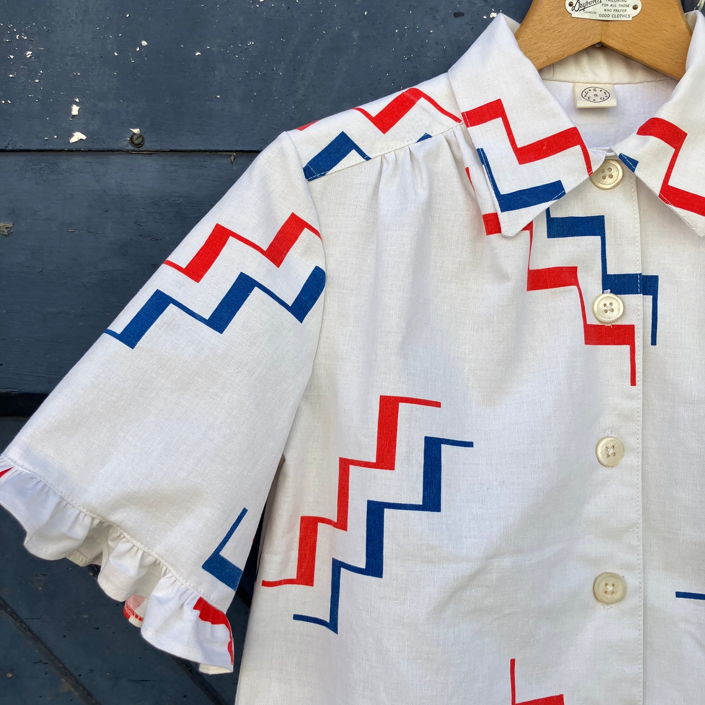 Geometric-print shirt with fancy ruffles around the sleeves