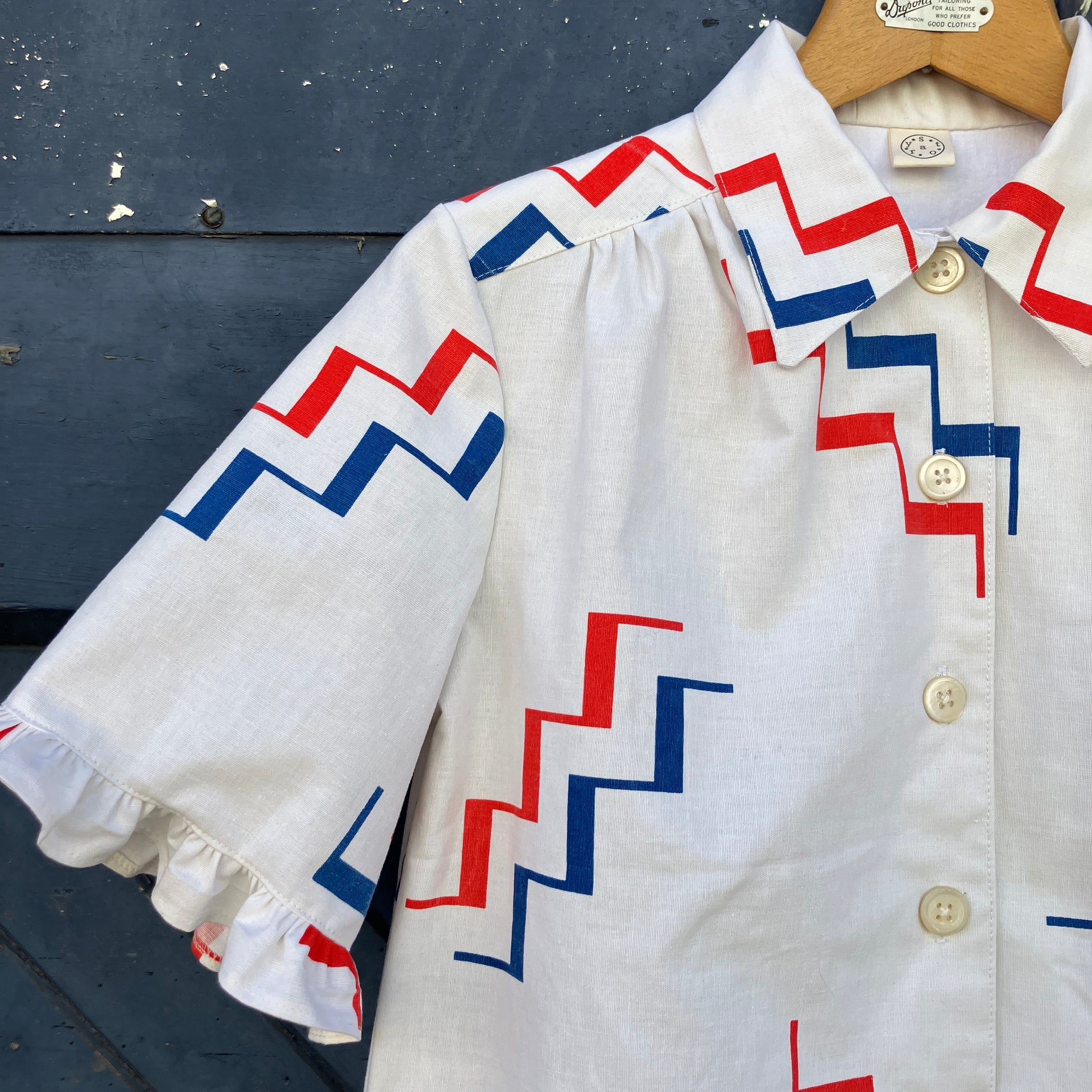 Geometric-print shirt with fancy ruffles around the sleeves