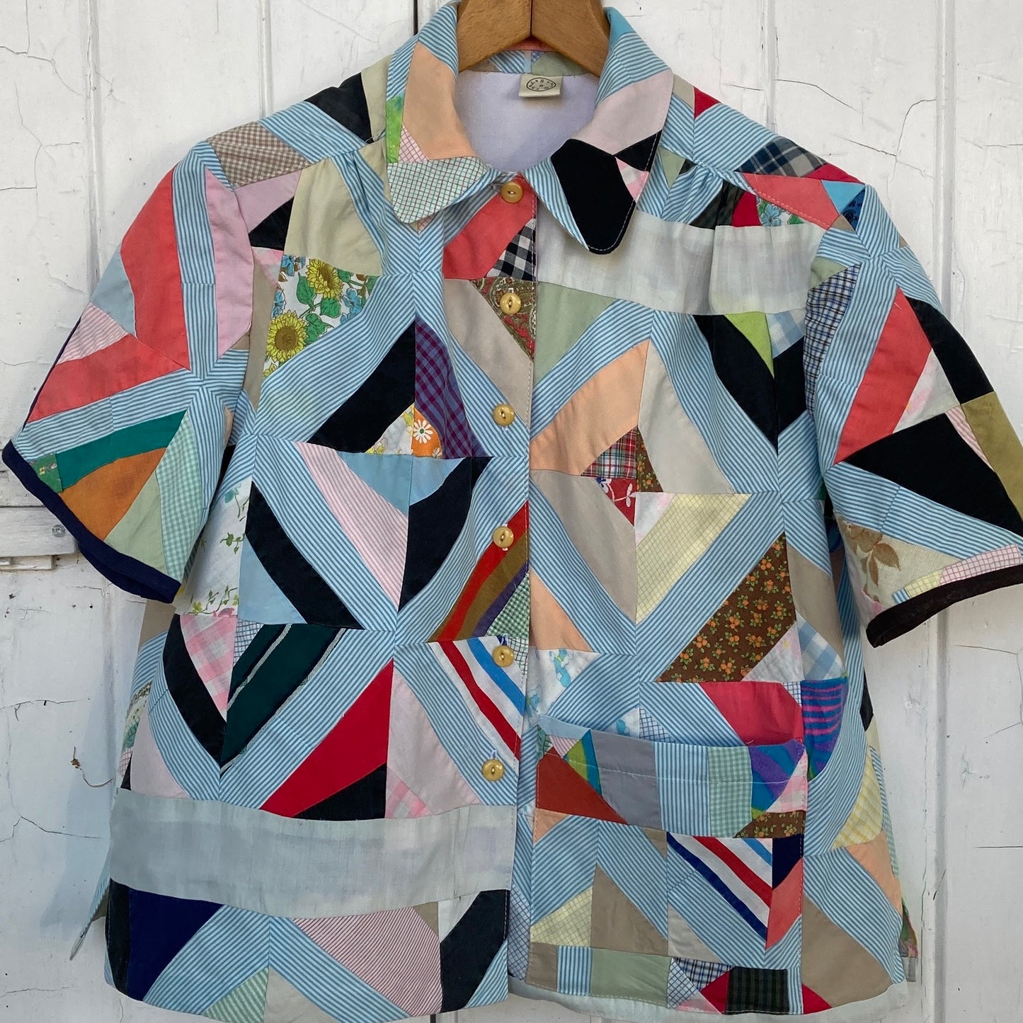 Short-sleeved shirt made from a found piece of 60s/70s patchwork in various bright and pastel colours