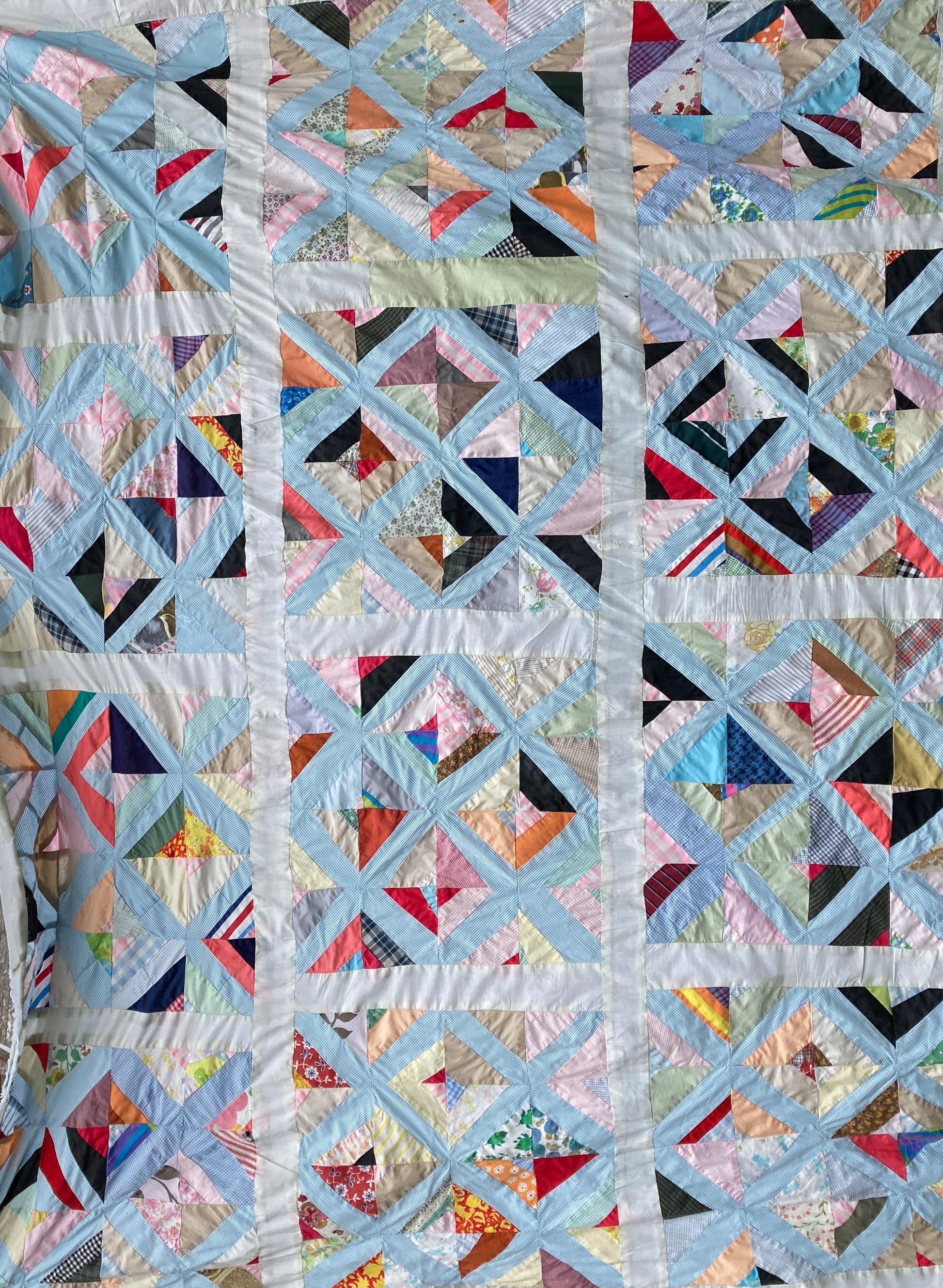 A found piece of 60s/70s patchwork in various bright and pastel colours, used to make a shirt