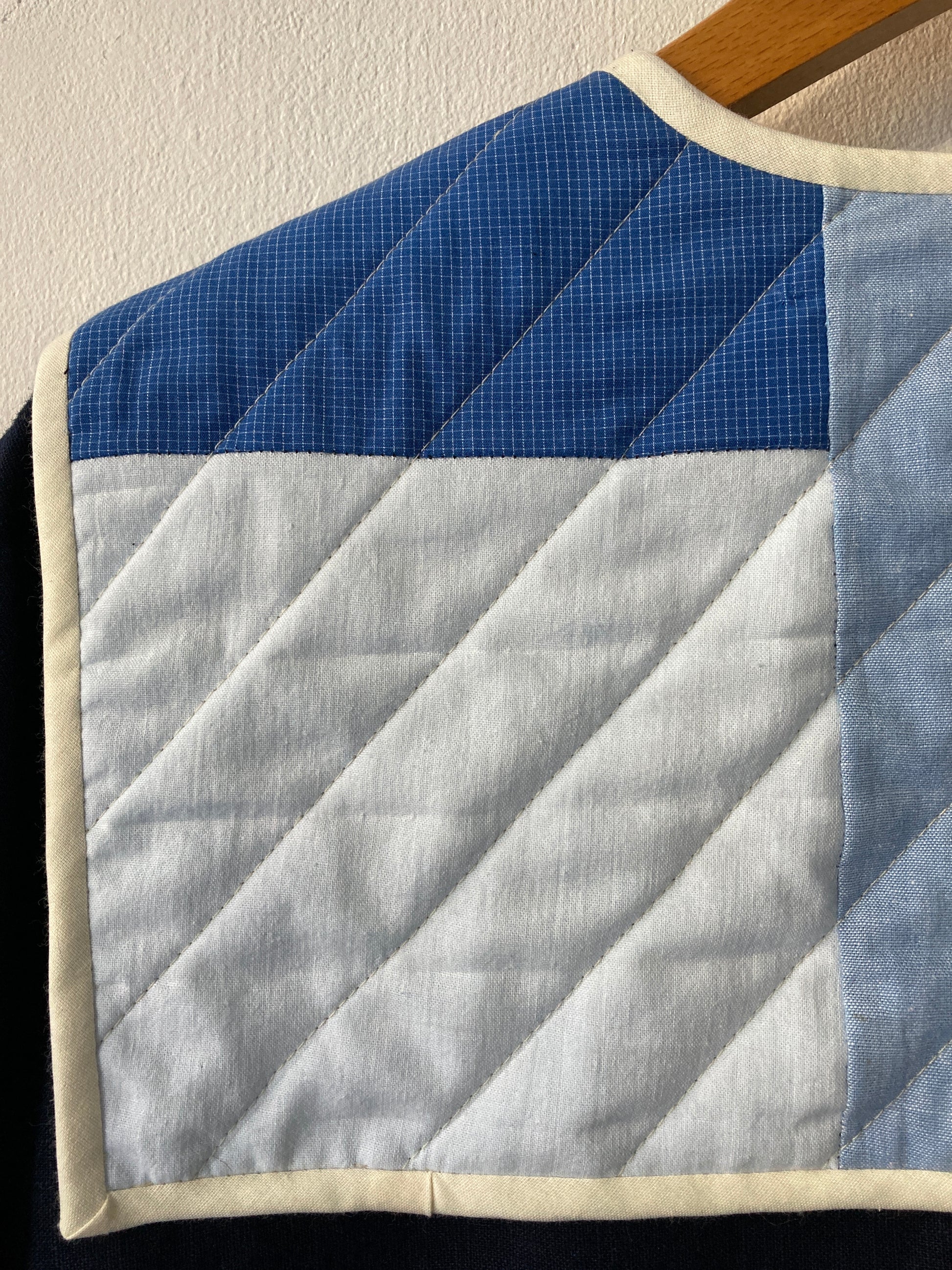Hand sewn navy blue linen shirt made from reclaimed fabric with a quilted patchwork sailor collar (close-up of collar)