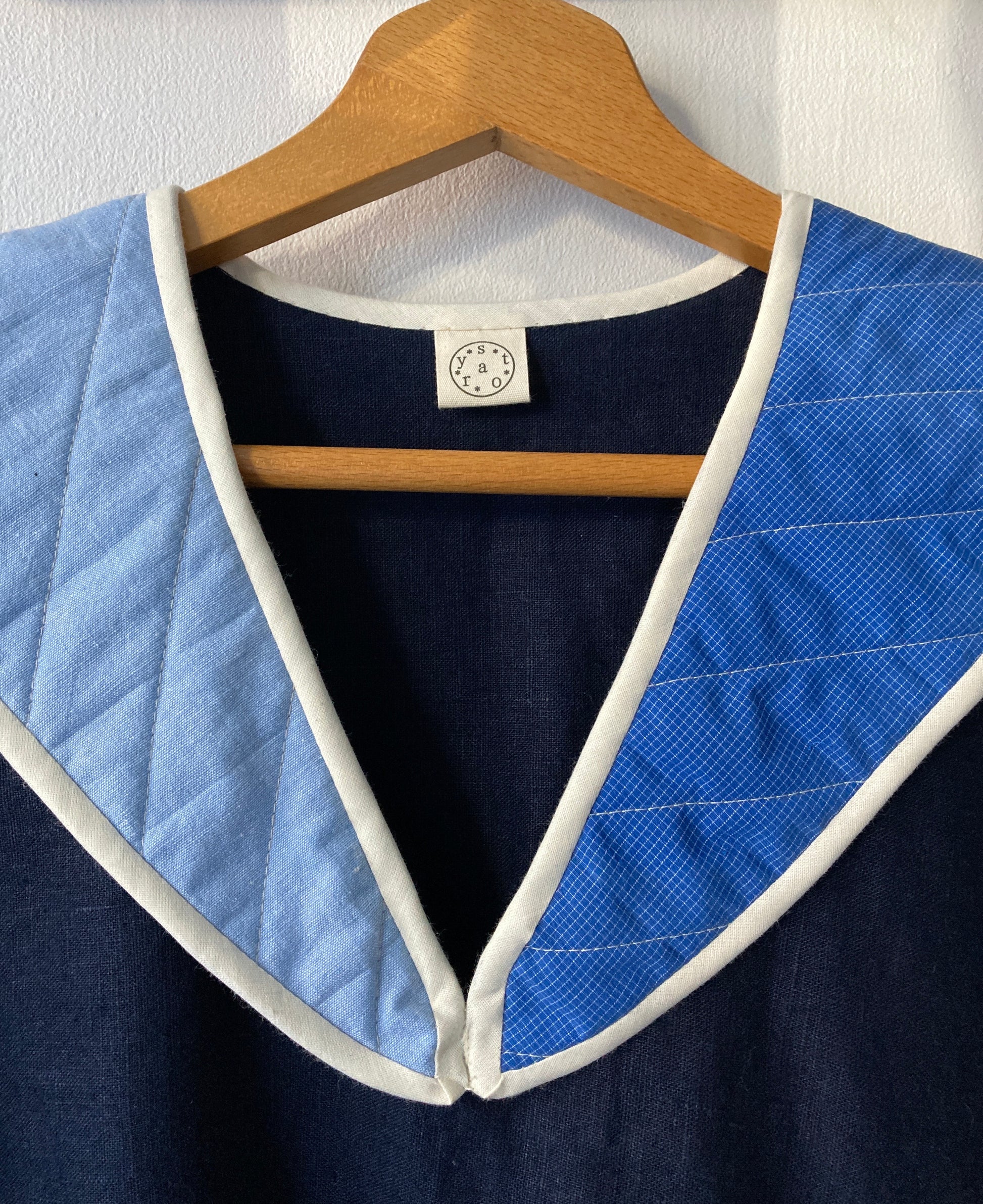 Hand sewn navy blue linen shirt made from reclaimed fabric with a quilted patchwork sailor collar (close-up of front)