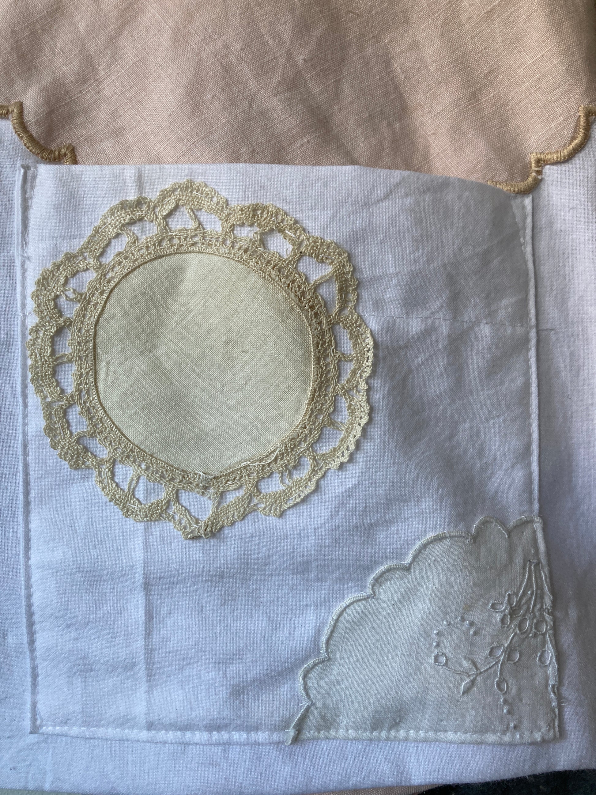 Handmade boxy shirt decorated with appliqué scallop-edge doilies (close-up of pocket)