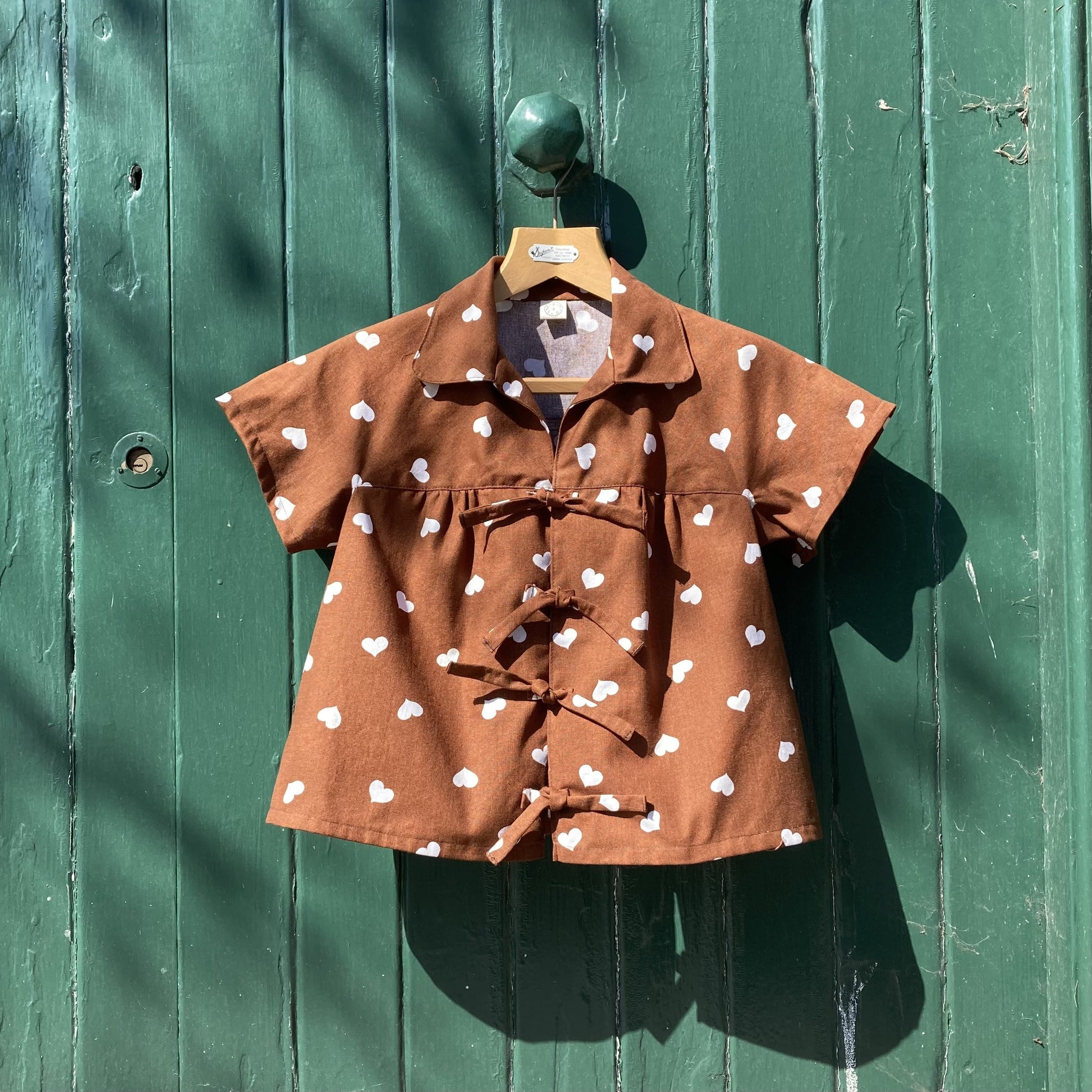 brown heart-print tie front top made from a recycled tablecloth