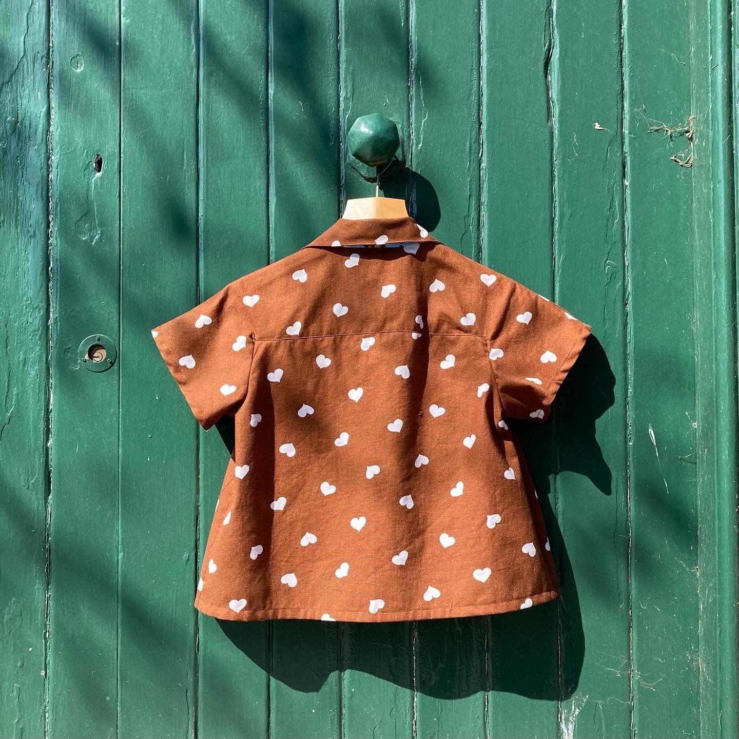 brown heart-print tie front top made from a recycled tablecloth, image shows the back