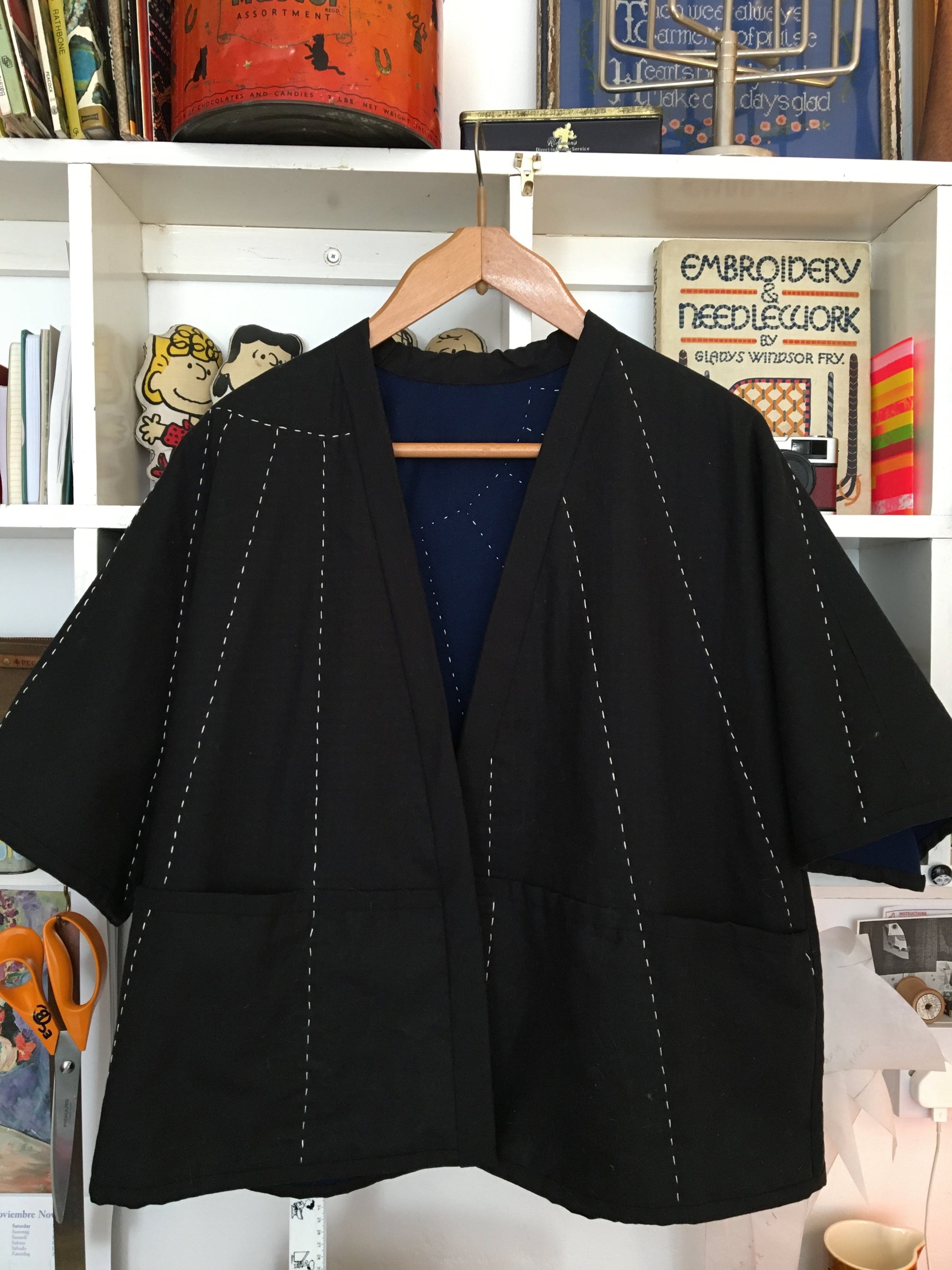 easy-fit quilted jacket with landscape and sunrays design hand quilted on the back