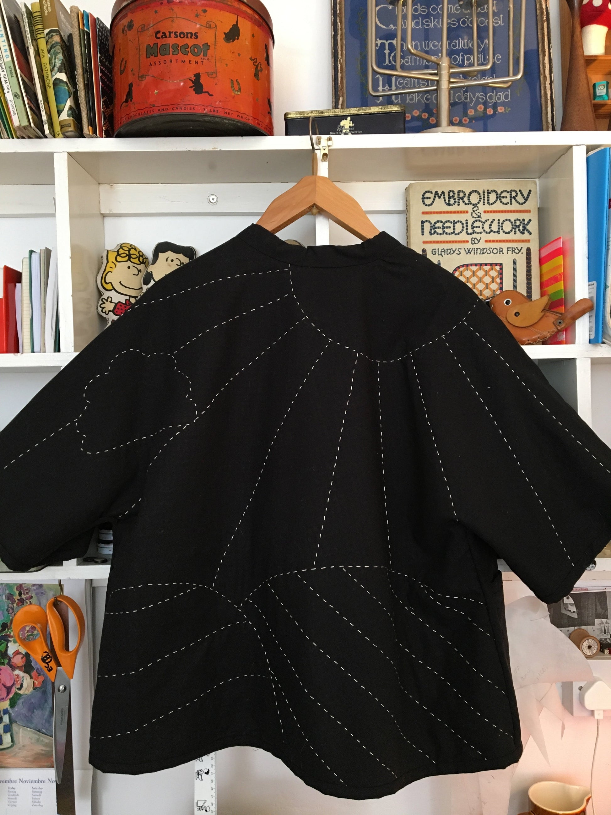 easy-fit quilted jacket with landscape and sunrays design hand quilted on the back
