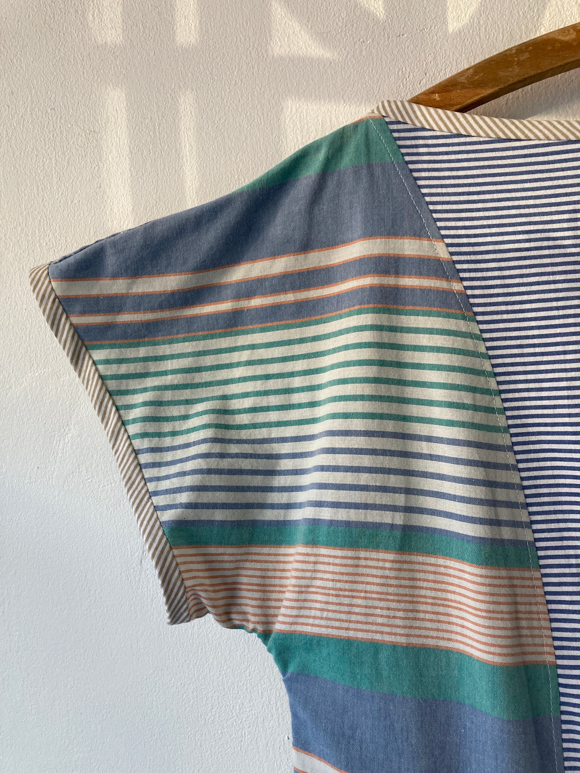 Handmade patchwork dress made from recycled cotton shirts using a vintage 1980s pattern. Boat neck. Pocket on bodice. Drop waist (close-up of sleeve)