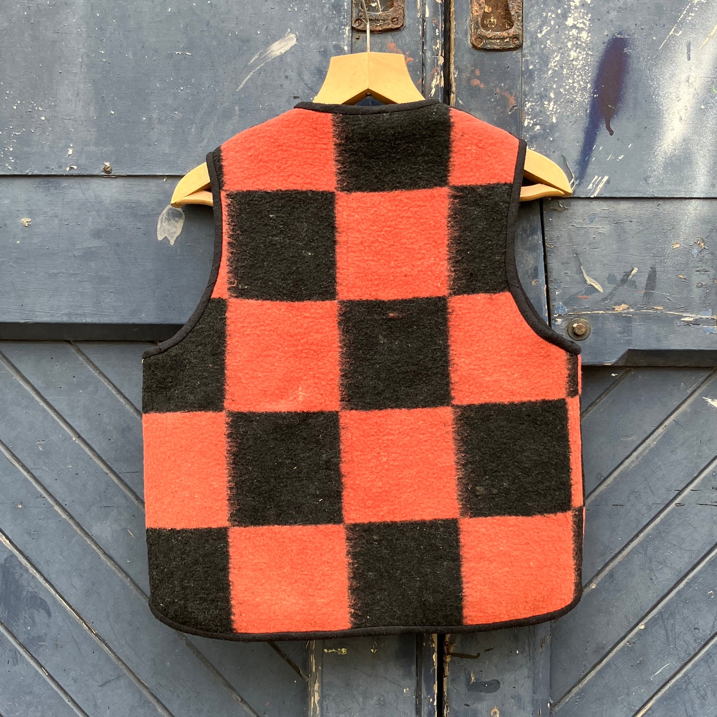 Cosy gilet/waistcoat/bodywarmer made from a fabulous pink and black checkerboard reclaimed wool blanket.