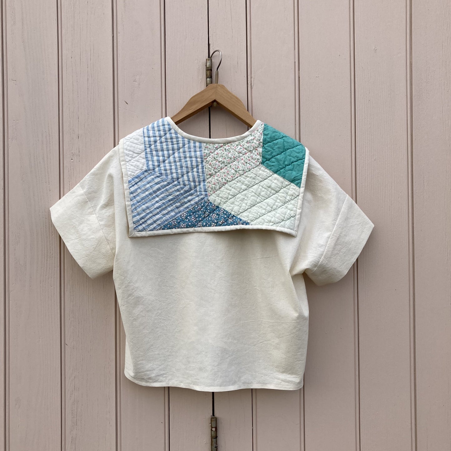 Boxy short-sleeved top made from found calico with a sailor collar cut from an antique patchwork quilt