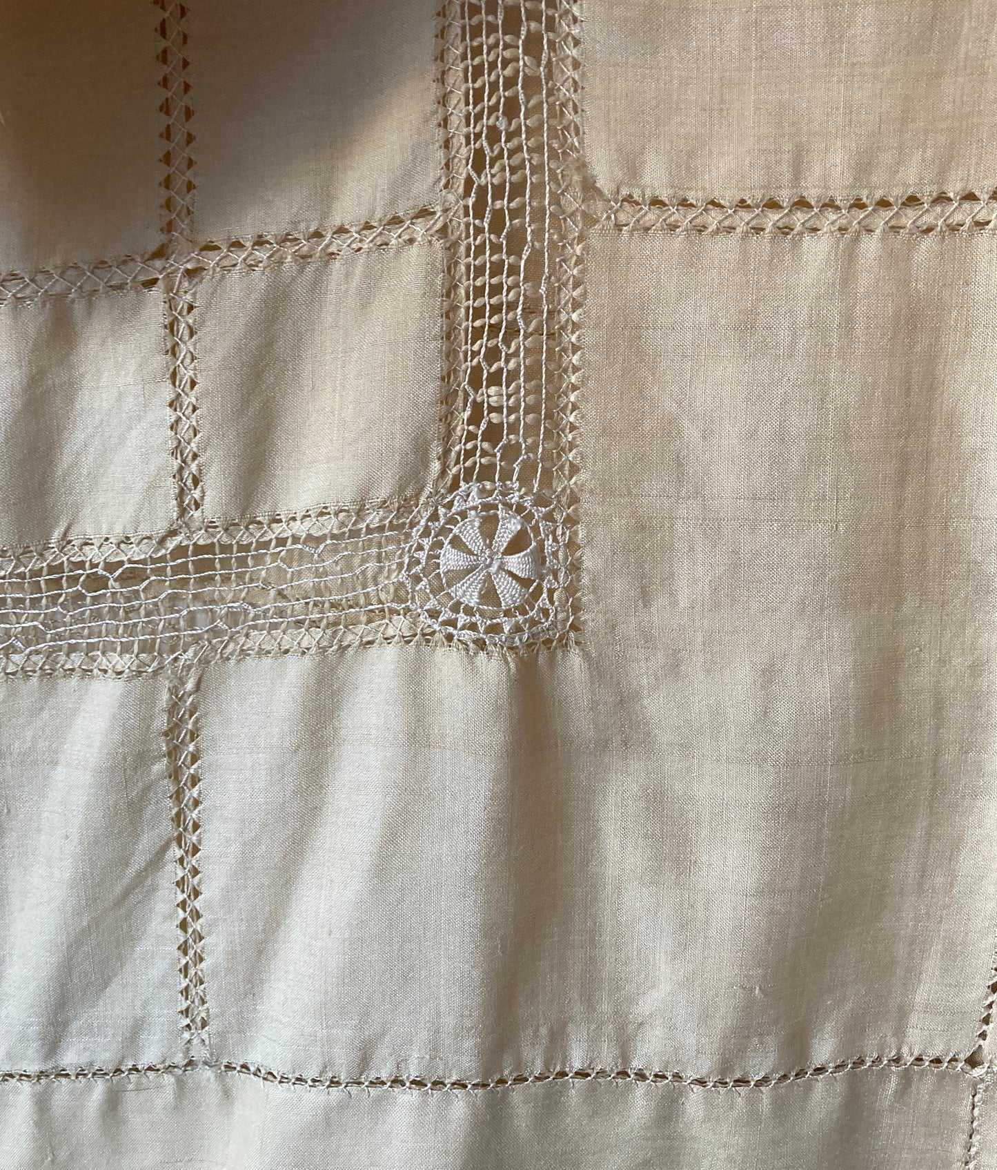 Sailor-collar shirt hand sewn from a reclaimed silk tablecloth, based on a vintage 80s pattern. Light and airy, cutwork detailing, fastens with found shell buttons (detail)