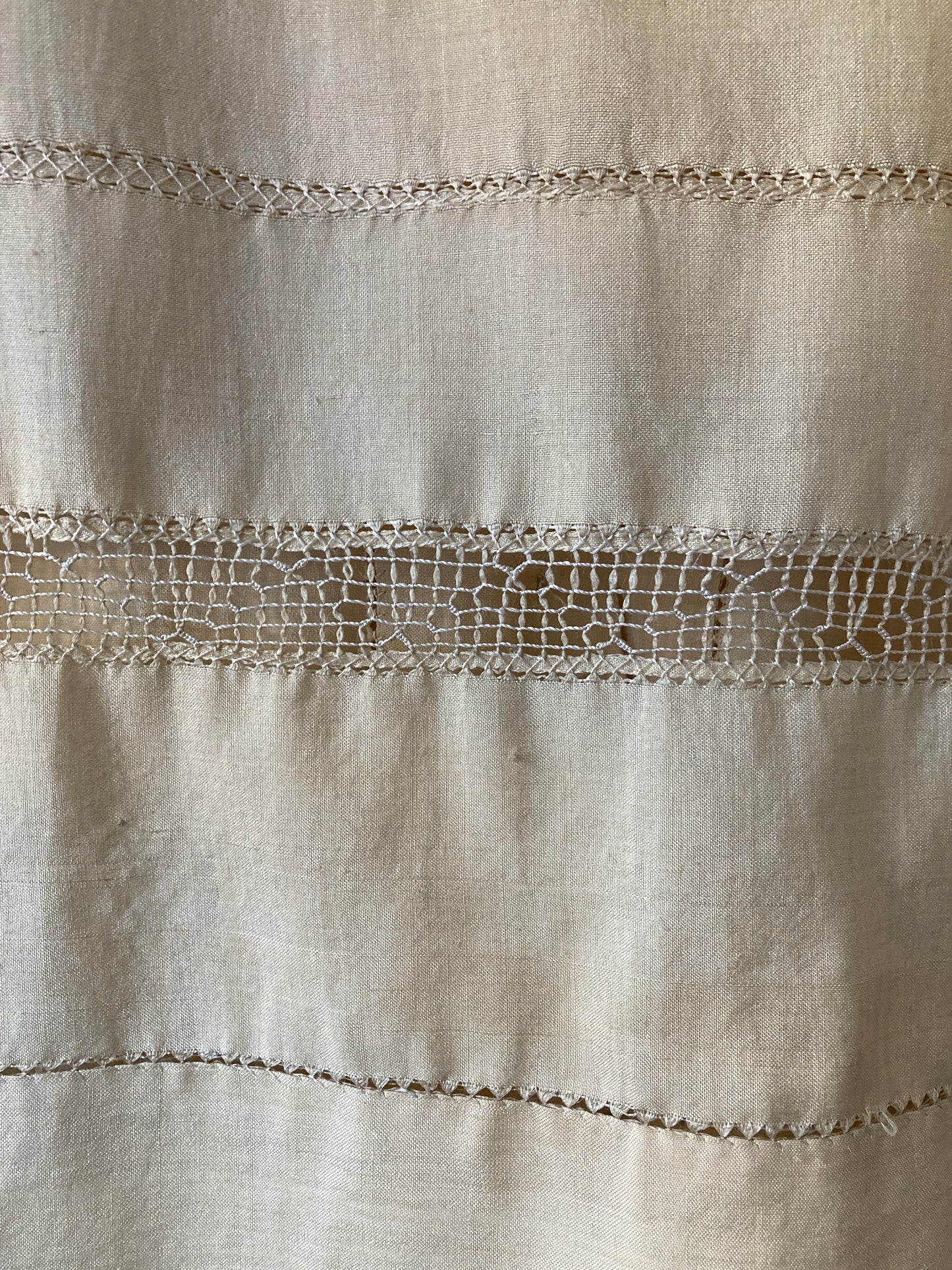 Sailor-collar shirt hand sewn from a reclaimed silk tablecloth, based on a vintage 80s pattern. Light and airy, cutwork detailing, fastens with found shell buttons (detail)