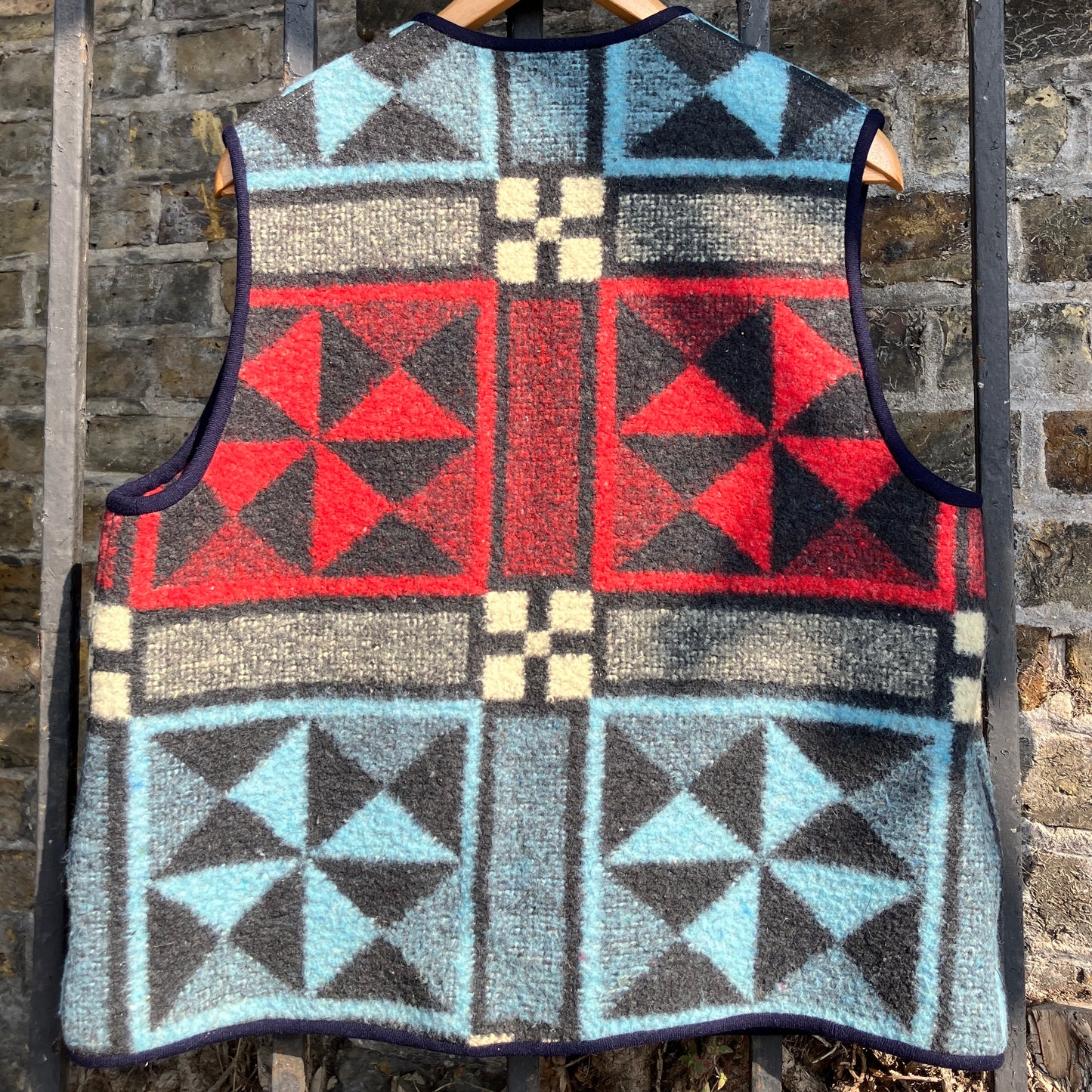 Cosy vest or waistcoat made from a reclaimed vintage patchwork-effect blanket.