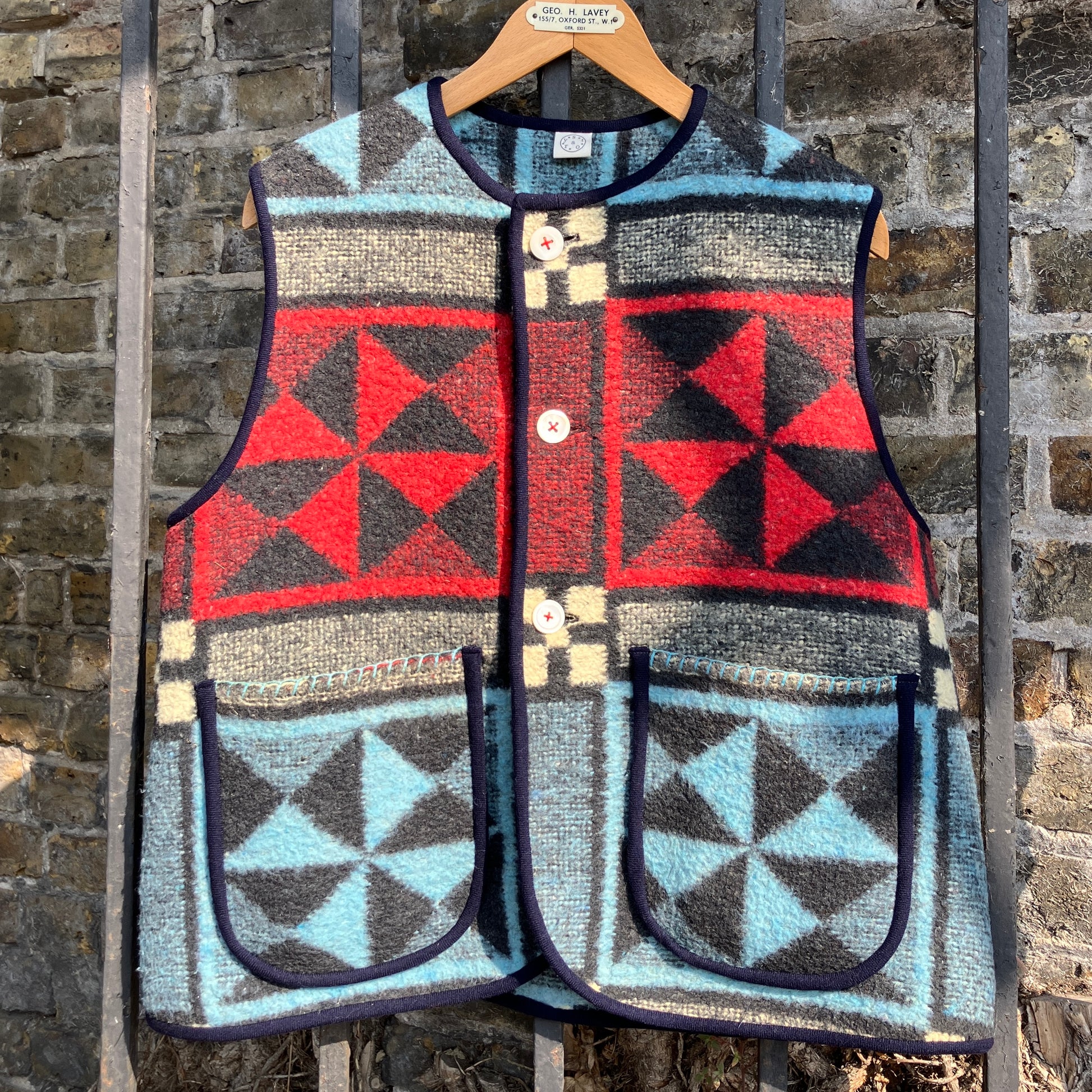 Cosy vest or waistcoat made from a reclaimed vintage patchwork-effect blanket.