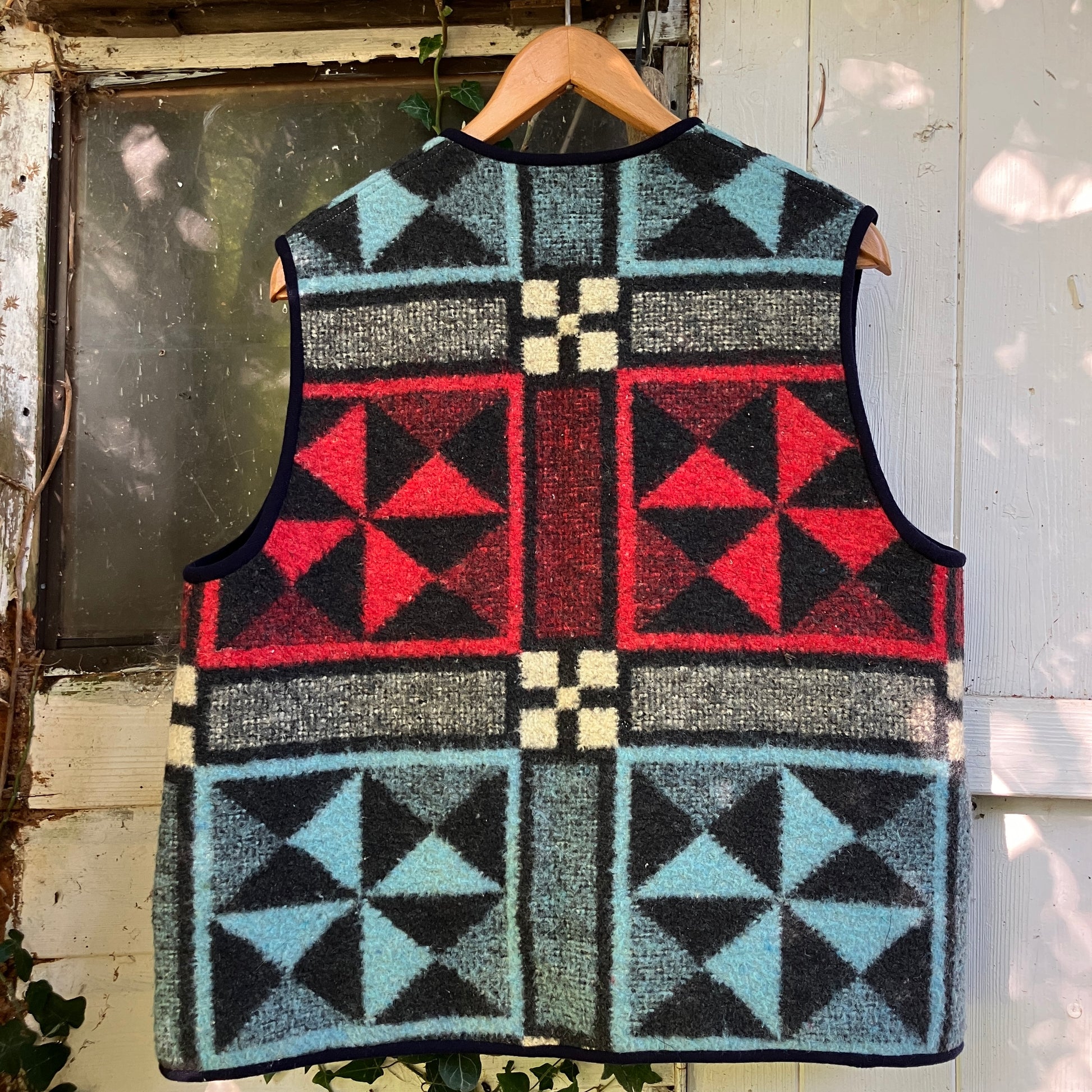 Cosy vest or waistcoat made from a reclaimed vintage patchwork-effect blanket.