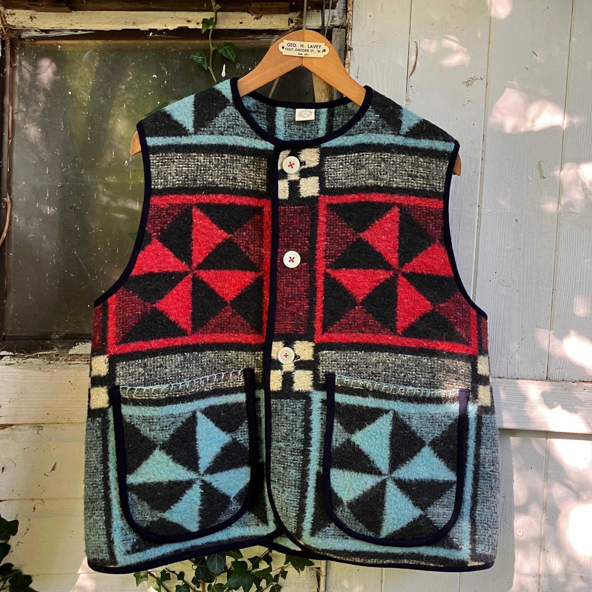 Cosy vest or waistcoat made from a reclaimed vintage patchwork-effect blanket.