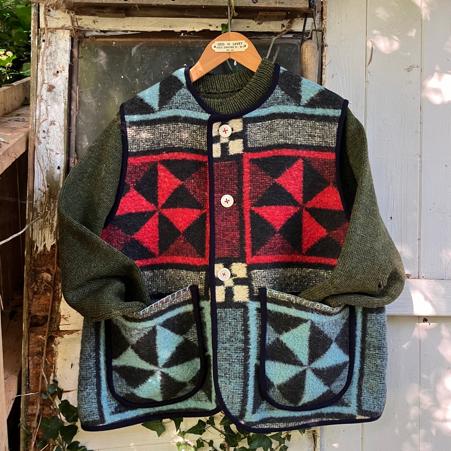 Cosy vest or waistcoat made from a reclaimed vintage patchwork-effect blanket.