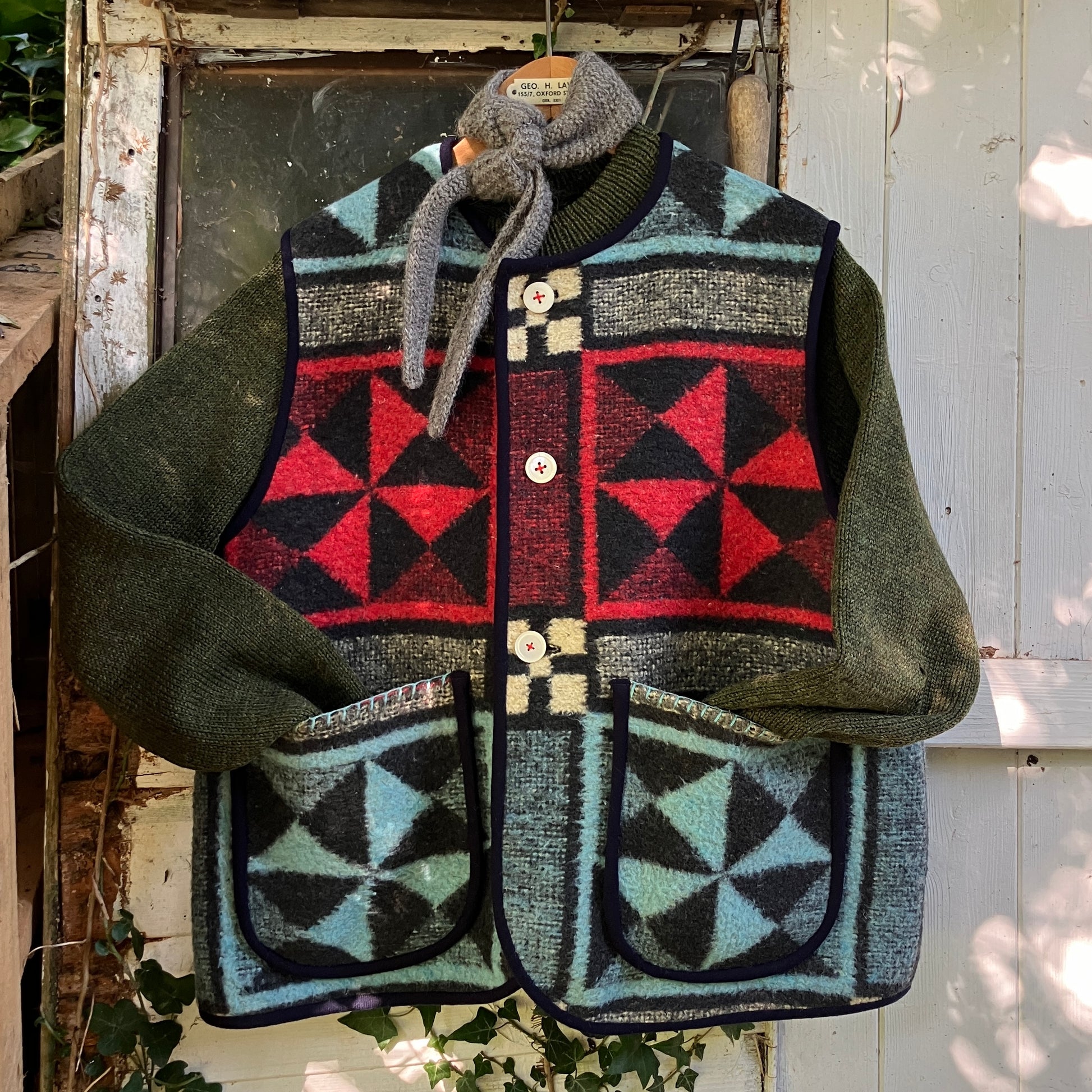 Cosy vest or waistcoat made from a reclaimed vintage patchwork-effect blanket.