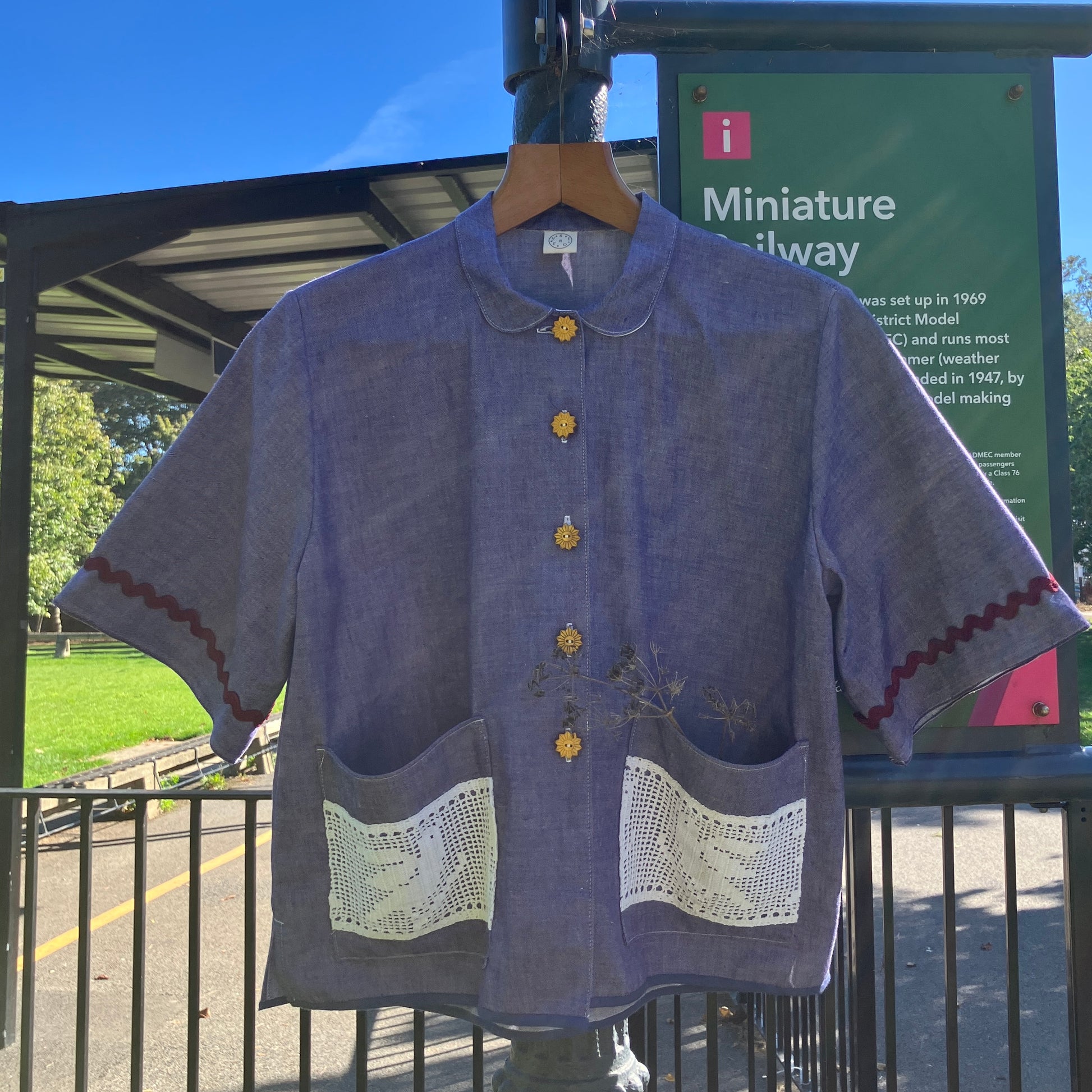 Reclaimed blue chambray shirt with star shaped buttons, birds on the pockets and rice-rac round the sleeves