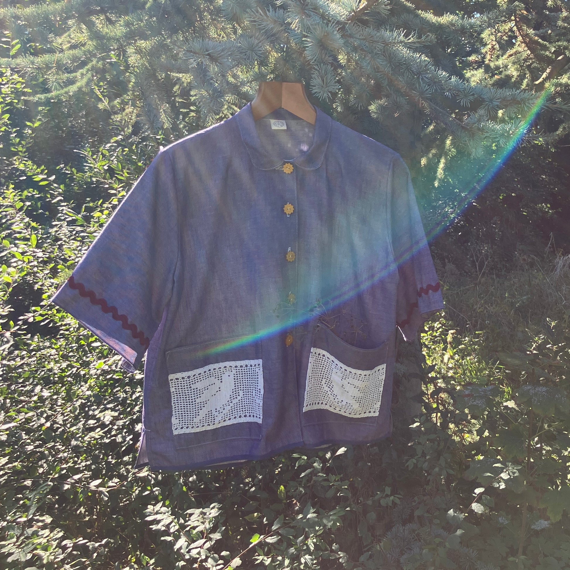 Reclaimed blue chambray shirt with star shaped buttons, birds on the pockets and rice-rac round the sleeves