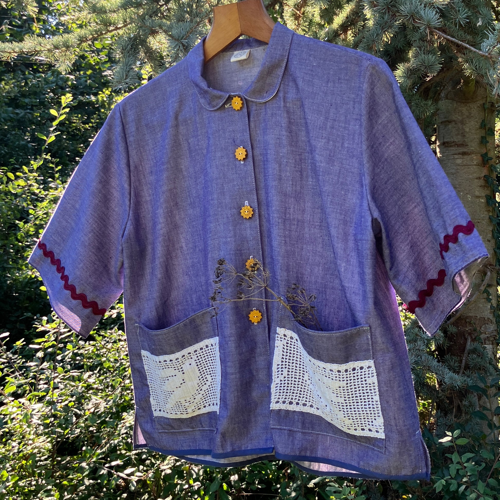 Reclaimed blue chambray shirt with star shaped buttons, birds on the pockets and rice-rac round the sleeves