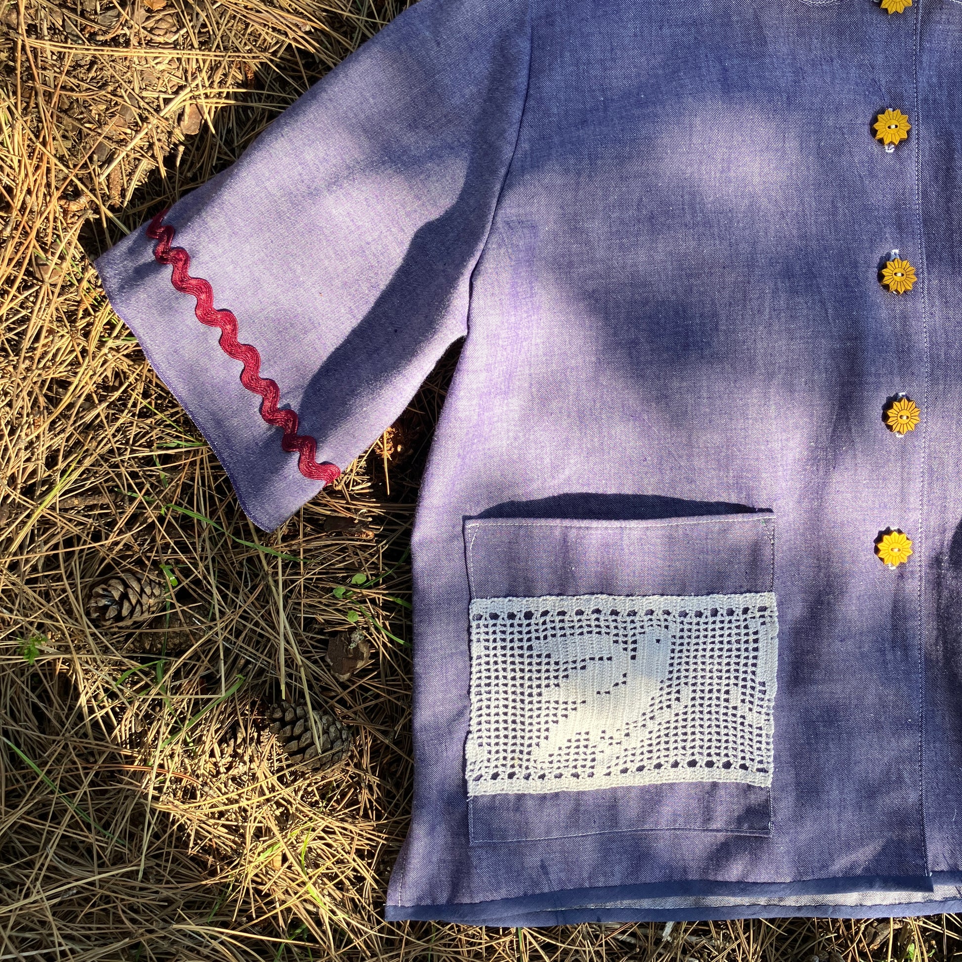 Reclaimed blue chambray shirt with star shaped buttons, birds on the pockets and ric-rac round the sleeves