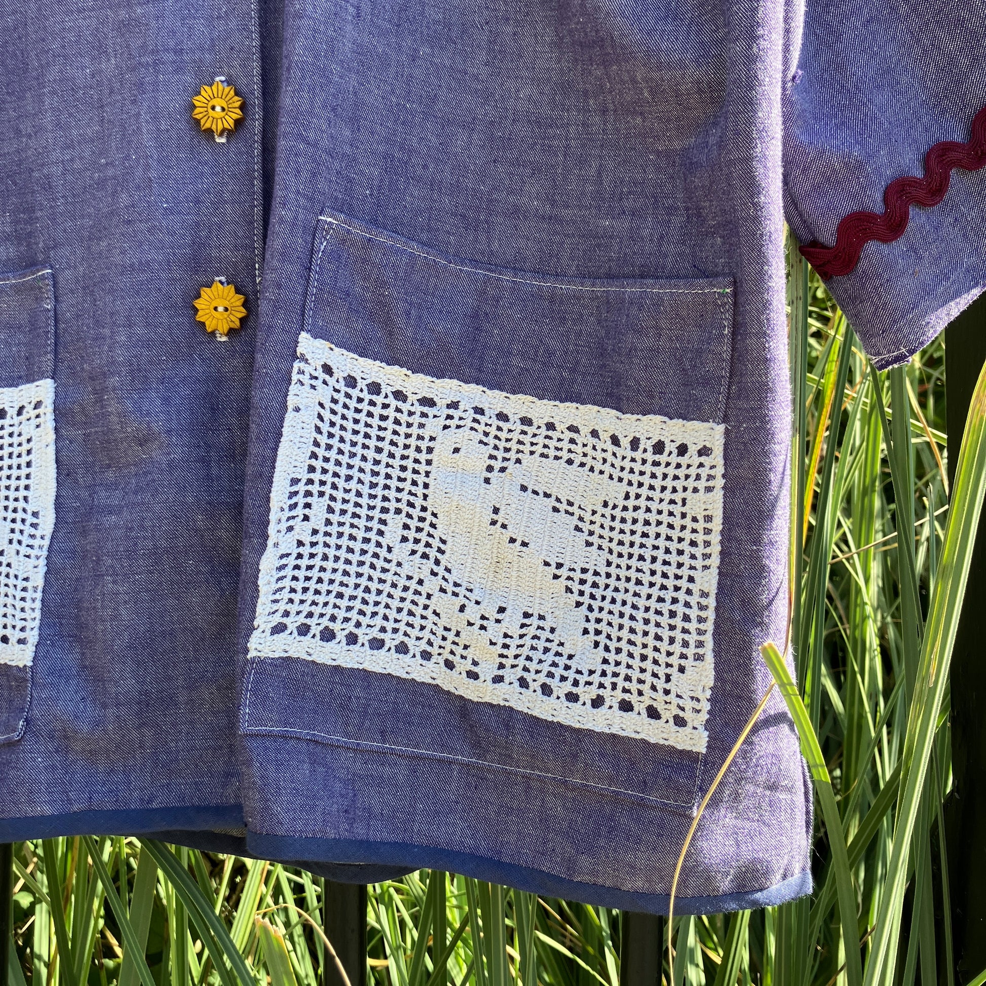 Reclaimed blue chambray shirt with star shaped buttons, birds on the pockets and ric-rac round the sleeves