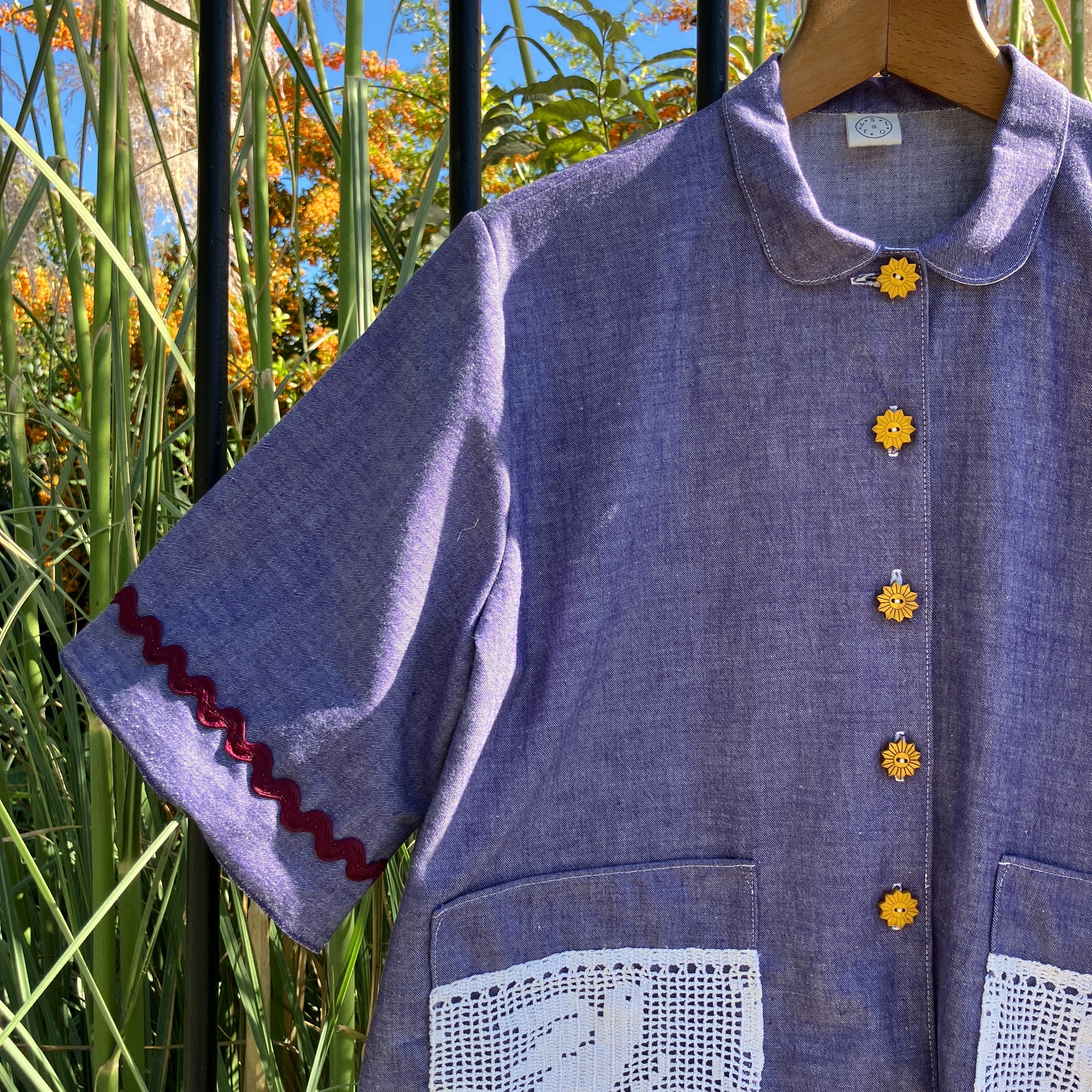 Reclaimed blue chambray shirt with star shaped buttons, birds on the pockets and ric-rac round the sleeves