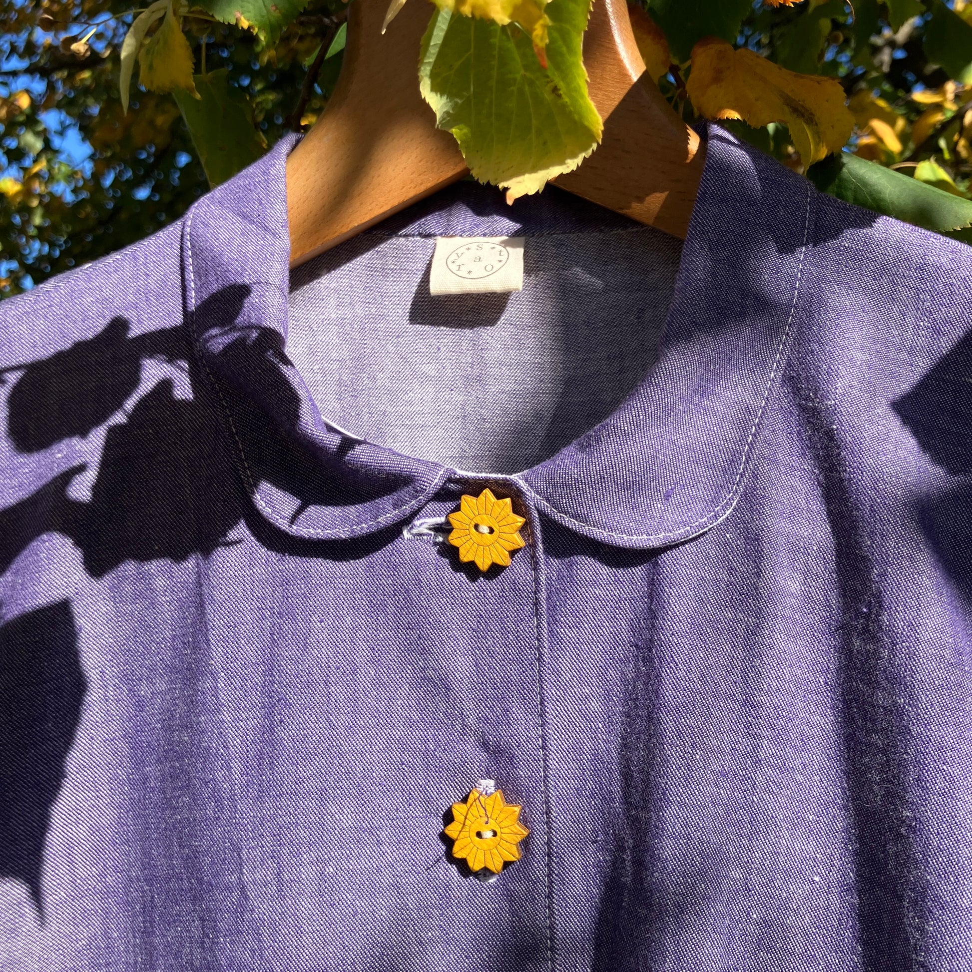 Reclaimed blue chambray shirt with star shaped buttons, birds on the pockets and ric-rac round the sleeves