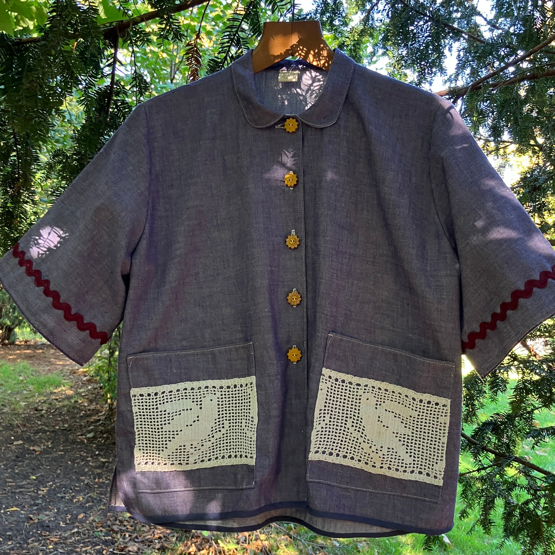 Reclaimed blue chambray shirt with star shaped buttons, birds on the pockets and ric-rac round the sleeves