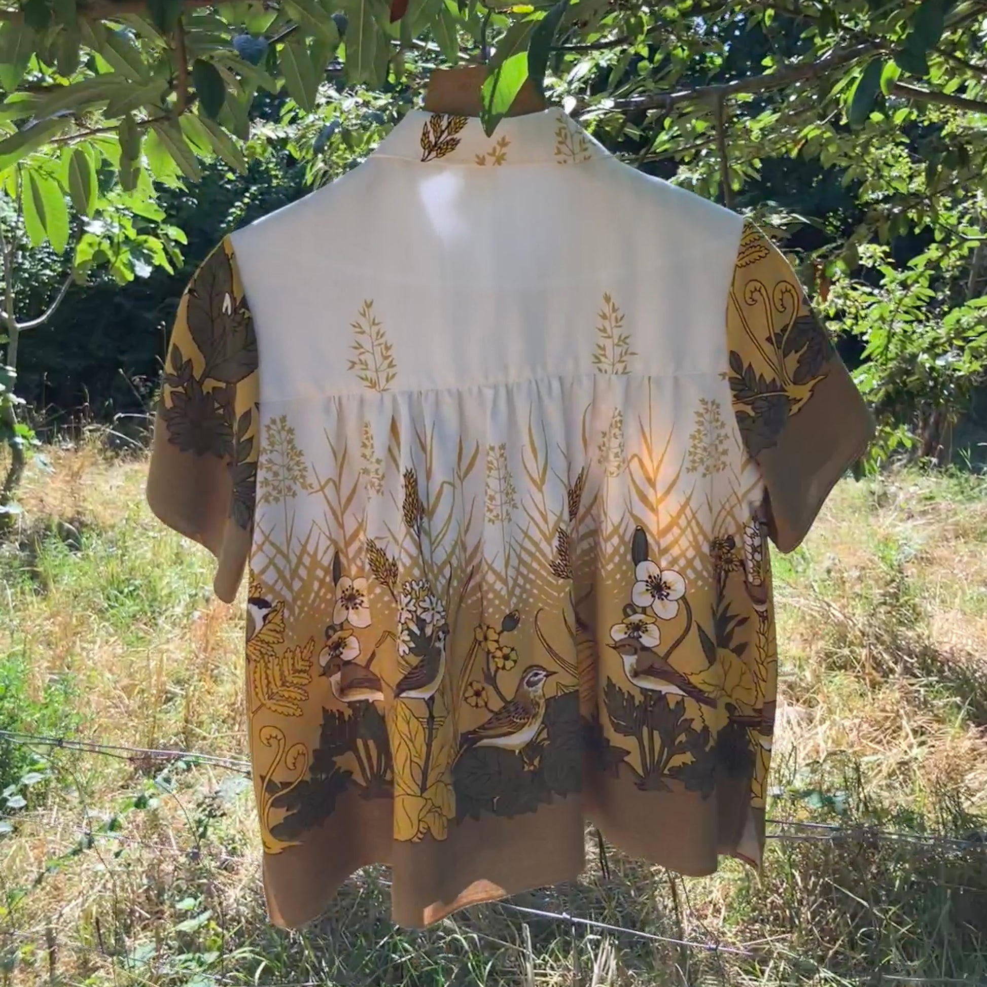 Shirt made from a recycled vintage 70s tablecloth featuring birds, birds nests, leaves, flowers and sheaves of wheat.