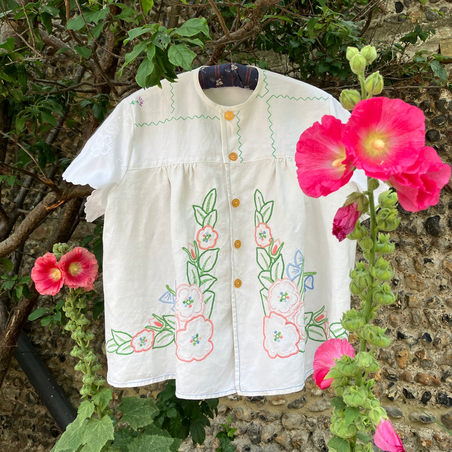 Swingy top made from found repurposed vintage tablecloths with embroidery and cutwork motifs.