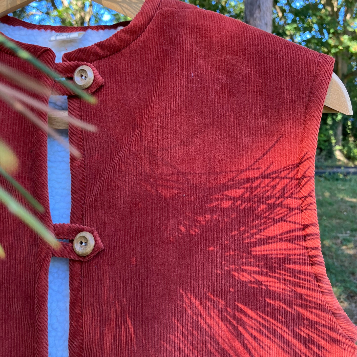 Cosy vest/waistcoat made from a secondhand remnant of rust-coloured corduroy, lined with found faux sheepskin fleece