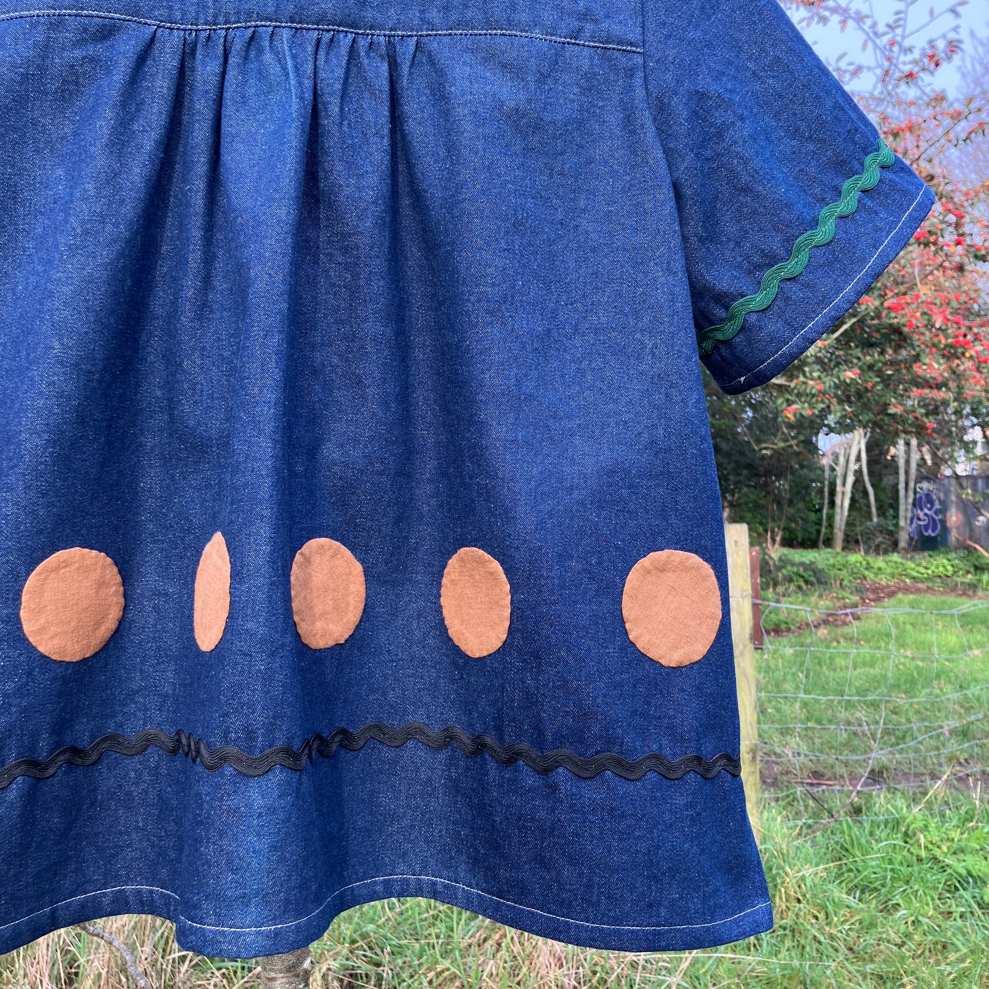 Shirt made from reclaimed denim with appliqué details and ric-rac