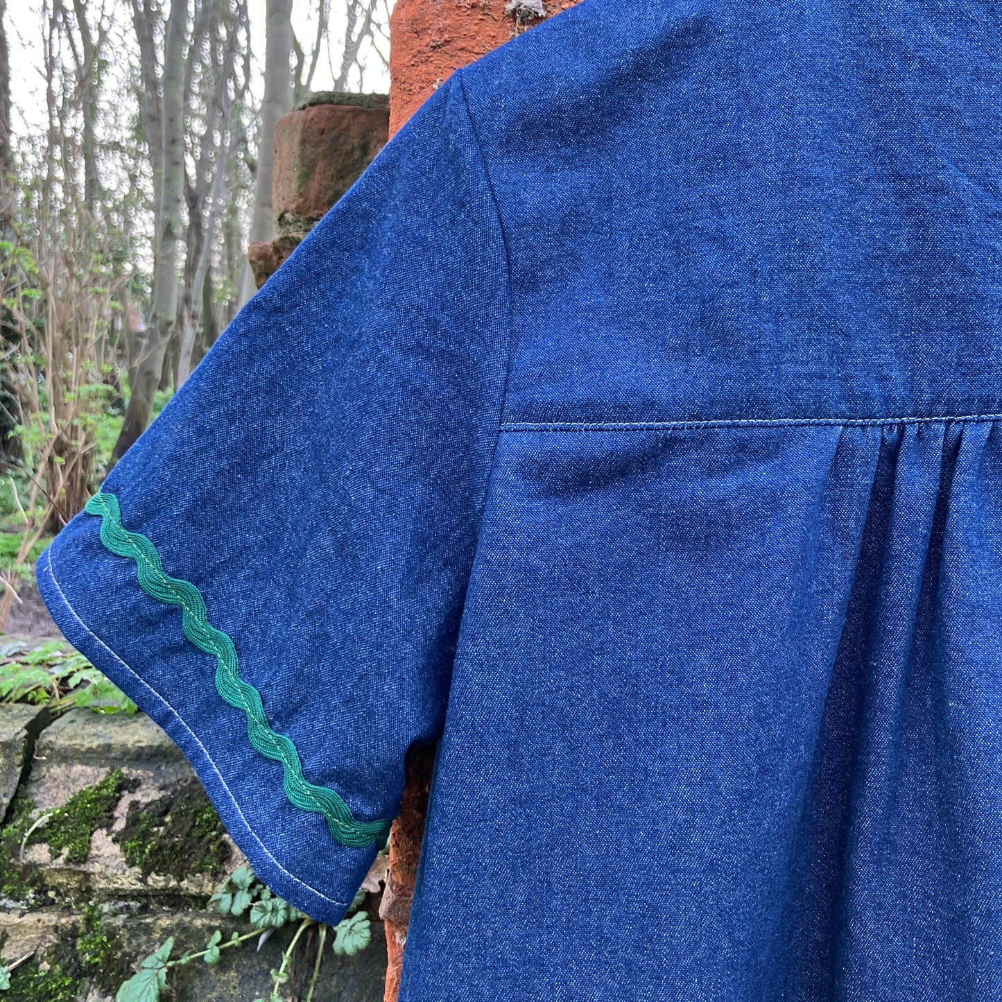 Shirt made from reclaimed denim with appliqué details and ric-rac