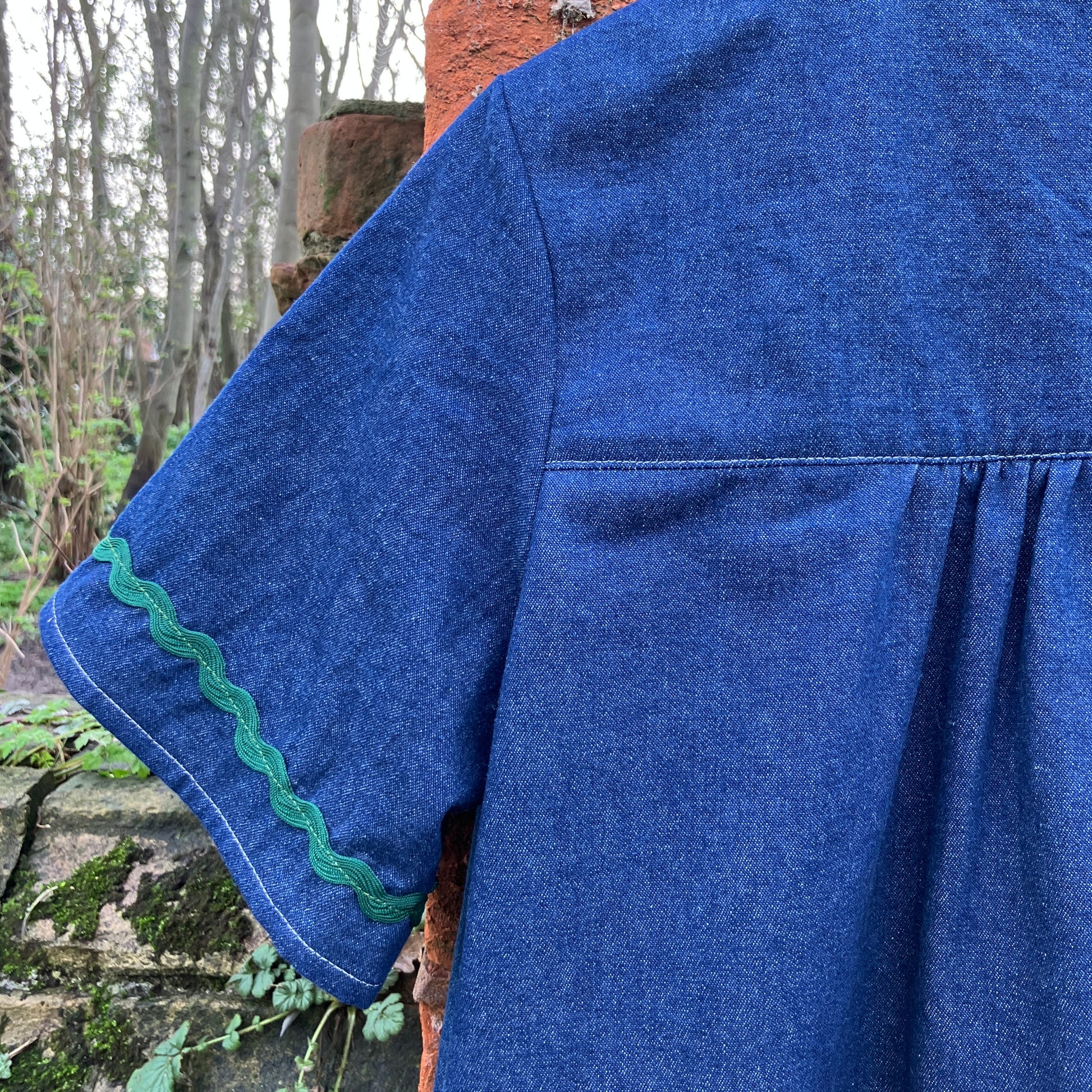 Shirt made from reclaimed denim with appliqué details and ric-rac