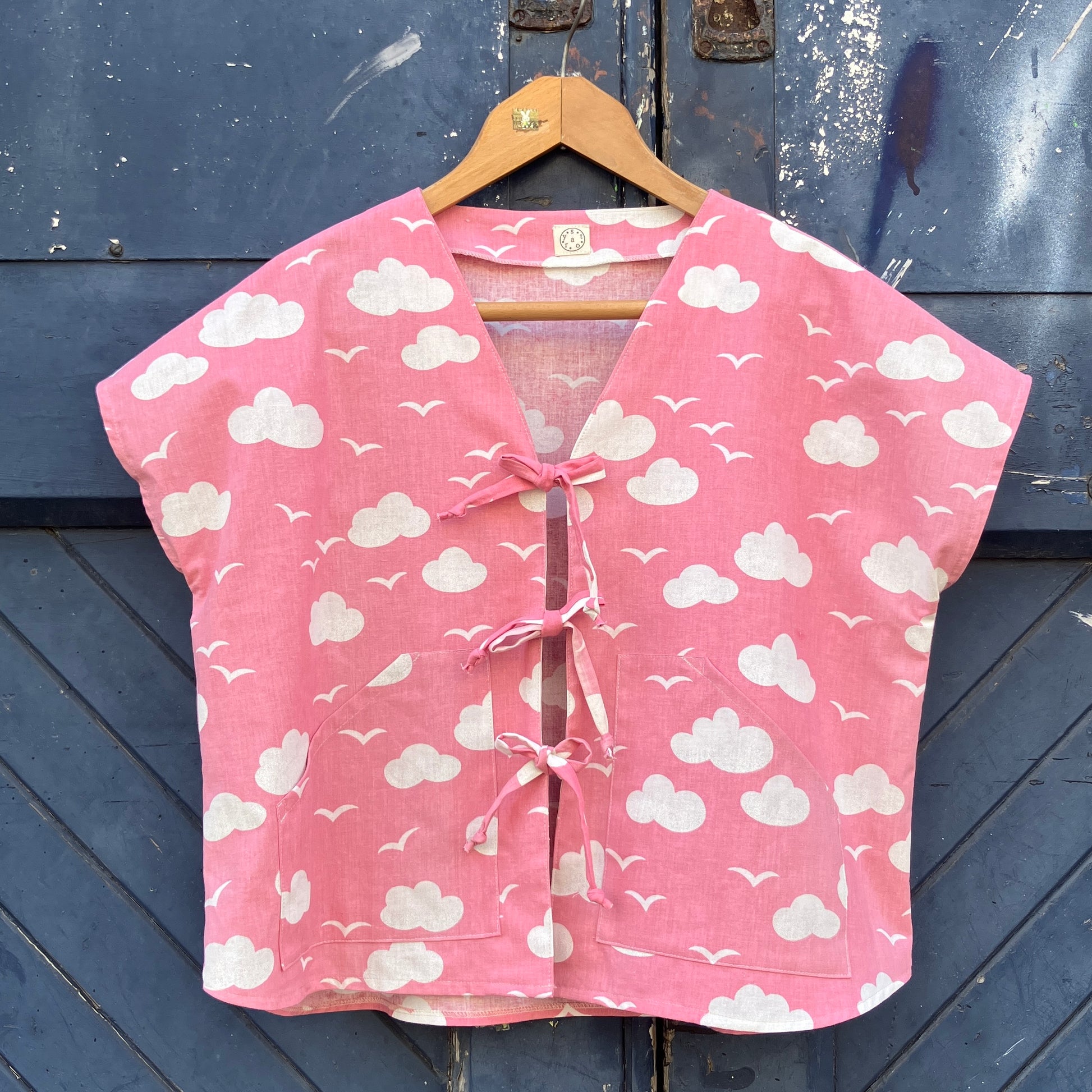Boxy-fit tie-front top made from a repurposed vintage pink 1980s cloud-print curtain