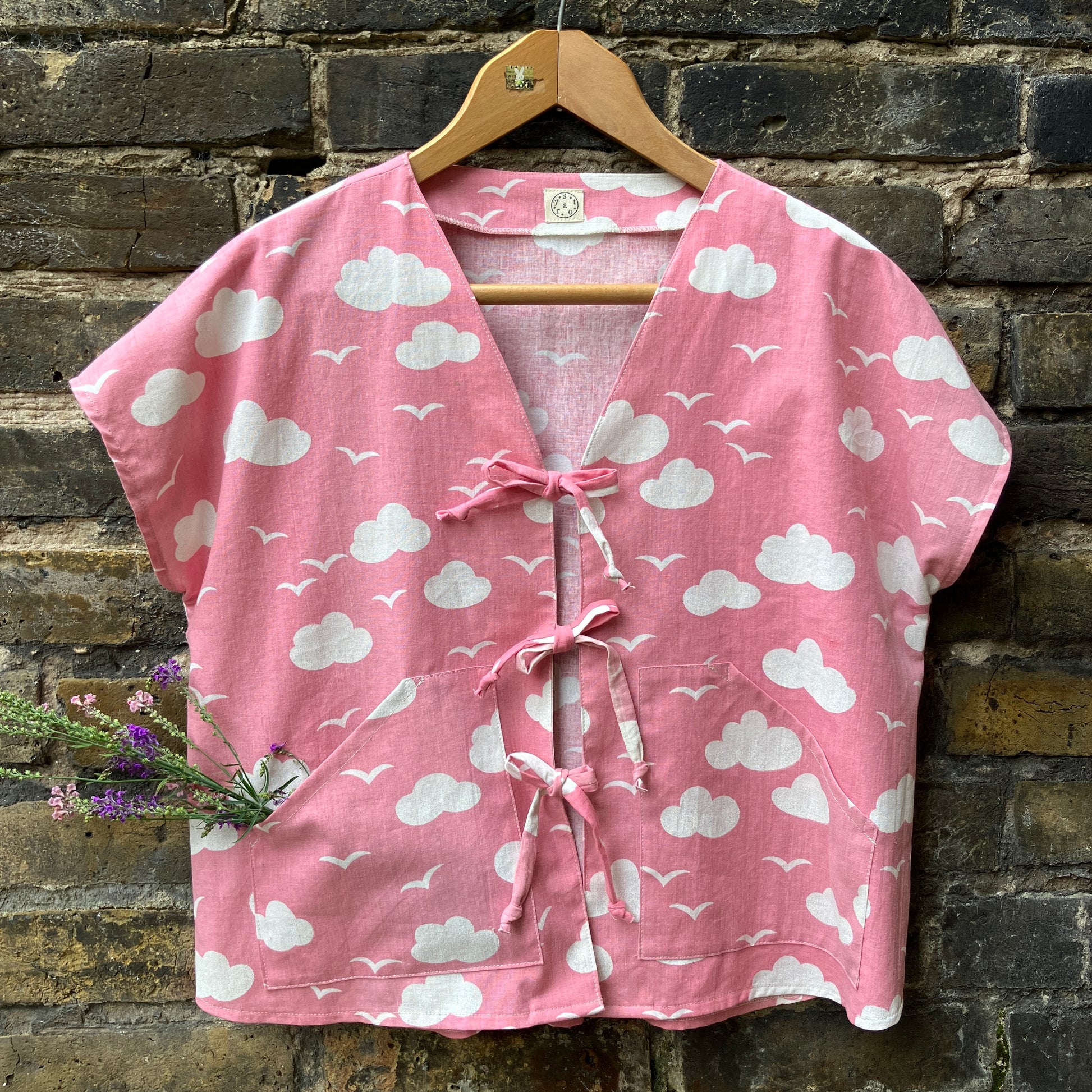 Boxy-fit tie-front top made from a repurposed vintage pink 1980s cloud-print curtain