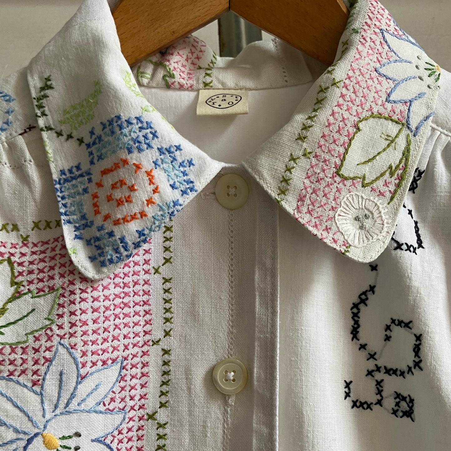 Recycled cross-stitch tablecloth shirt