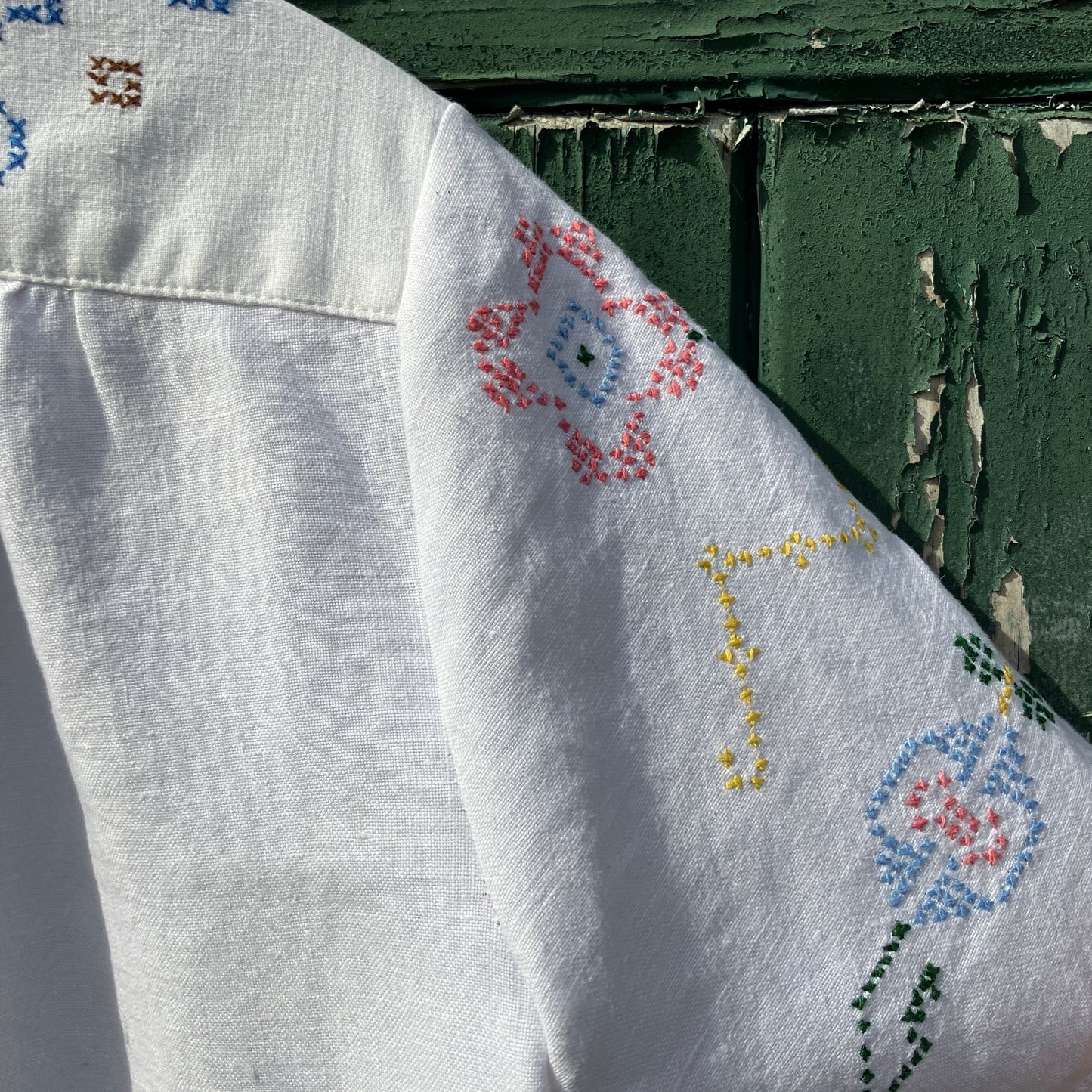 Recycled cross-stitch tablecloth shirt