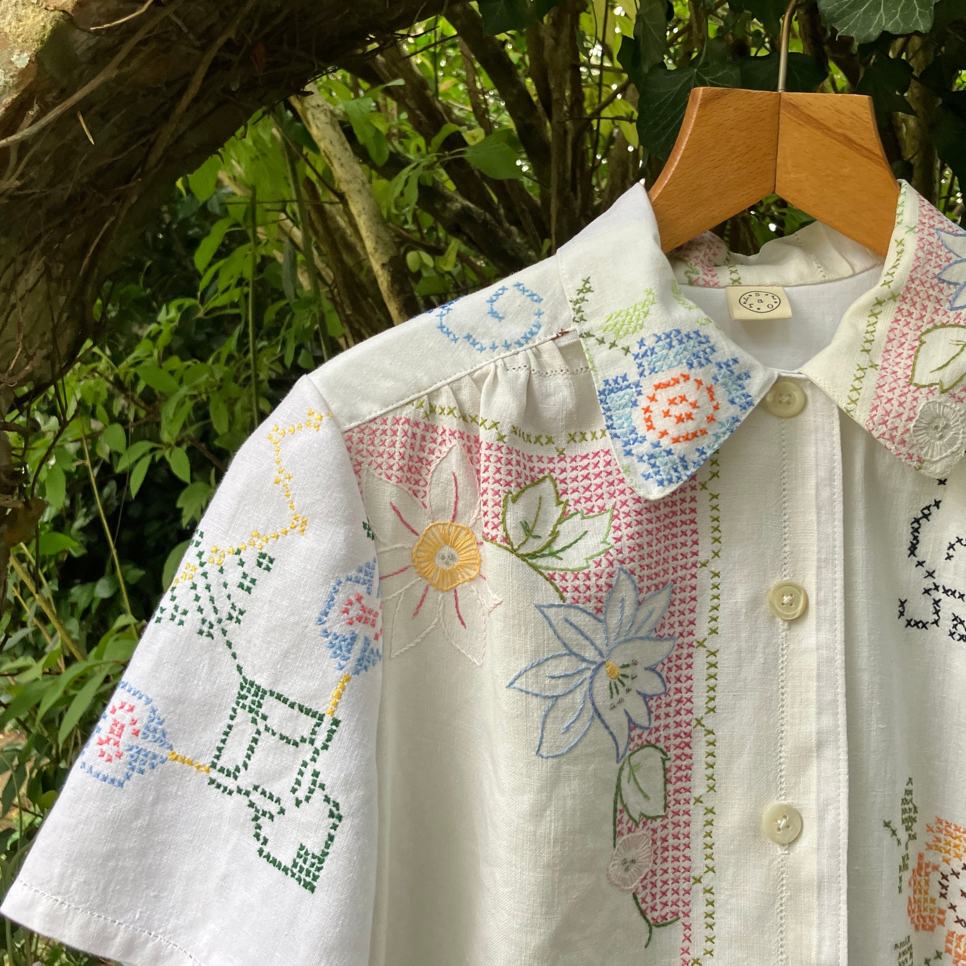 Recycled cross-stitch tablecloth shirt