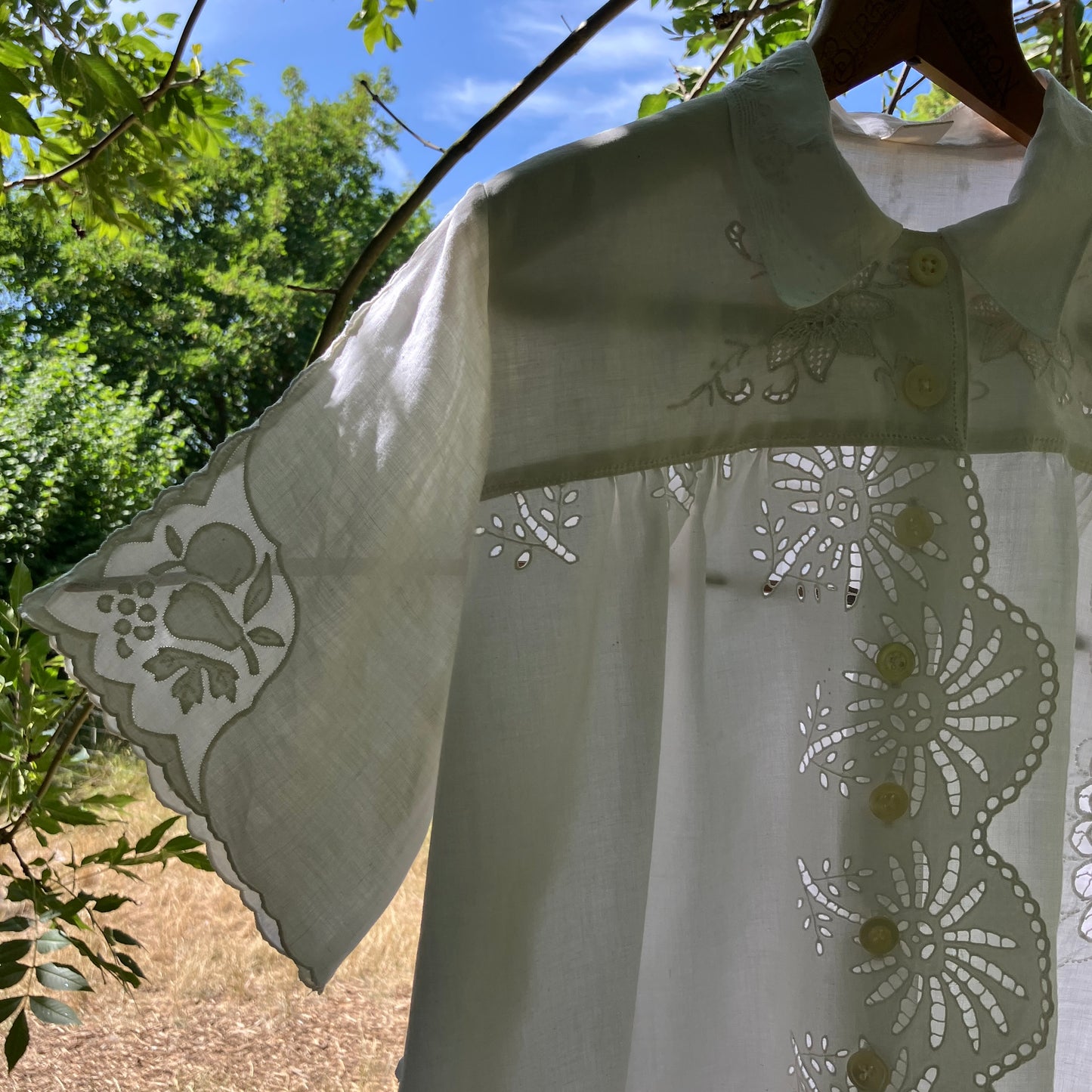 shirt made from a patchwork of recycled vintage white table linen
